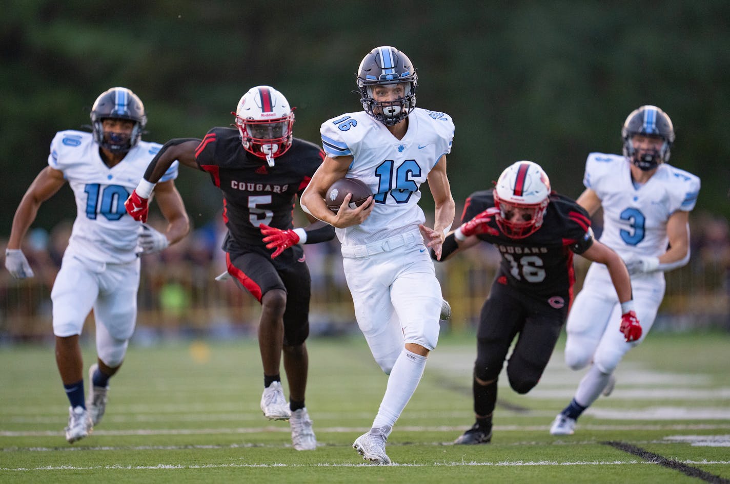 Blaine quarterback Sam Shaughnessy (16) breaks away for a touchdown run against Centennial in the first quarter Friday, Sep. 08, 2023, at Centennial High School in Circle Pines, Minn. ]