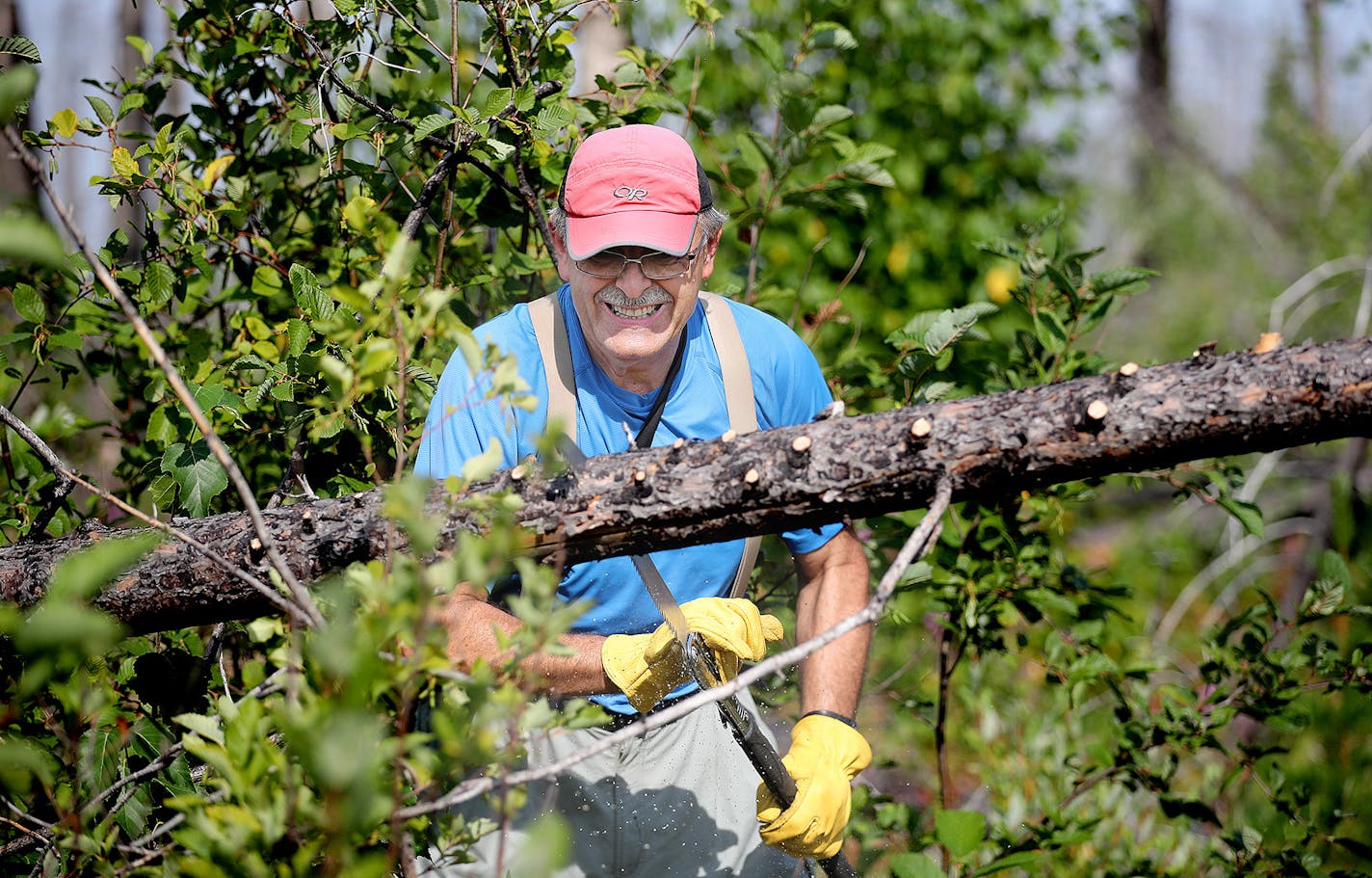 Martin Kubik trimmed a tree that had fallen on the Powwow Trail. The U.S. Forest Service will stop clearing the trail to help it to recover from a fire, a decision that doesn&#x2019;t sit well with Kubik.