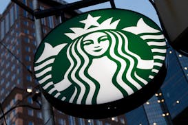FILE - The Starbucks sign is displayed in the window of a Pittsburgh Starbucks, Jan. 30, 2023.