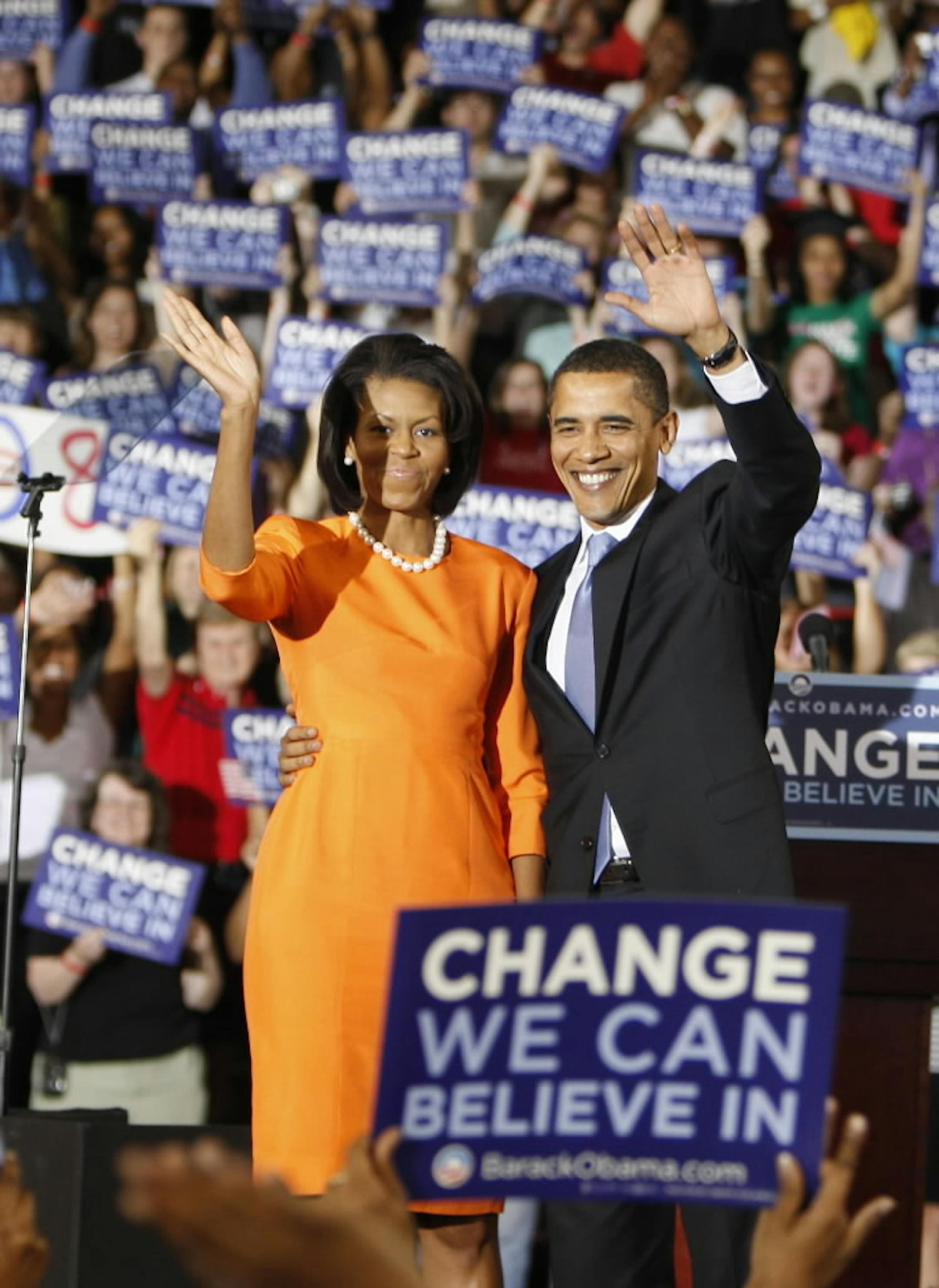 Barack Obama stands on stage with his wife Michelle during a primary results rally in Raleigh, N.C.