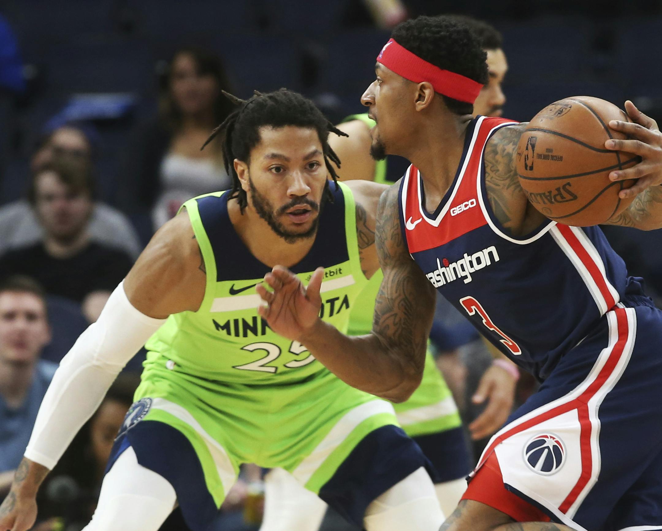 Washington Wizards' Bradley Beal, right, drives against Minnesota Timberwolves' Derrick Rose in the first half of an NBA basketball game Saturday, March 9, 2019, in Minneapolis. (AP Photo/Jim Mone)