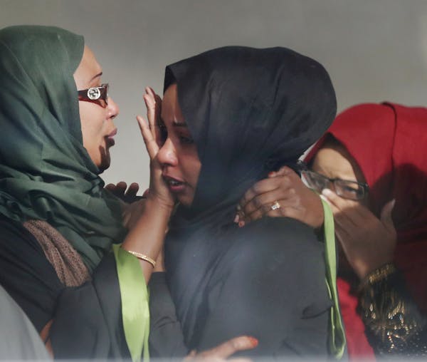 Following the sentencing of Hanad Musse to 10 years in prison and 20 years supervised release, supporters of Musse became emotional in a hallway insid