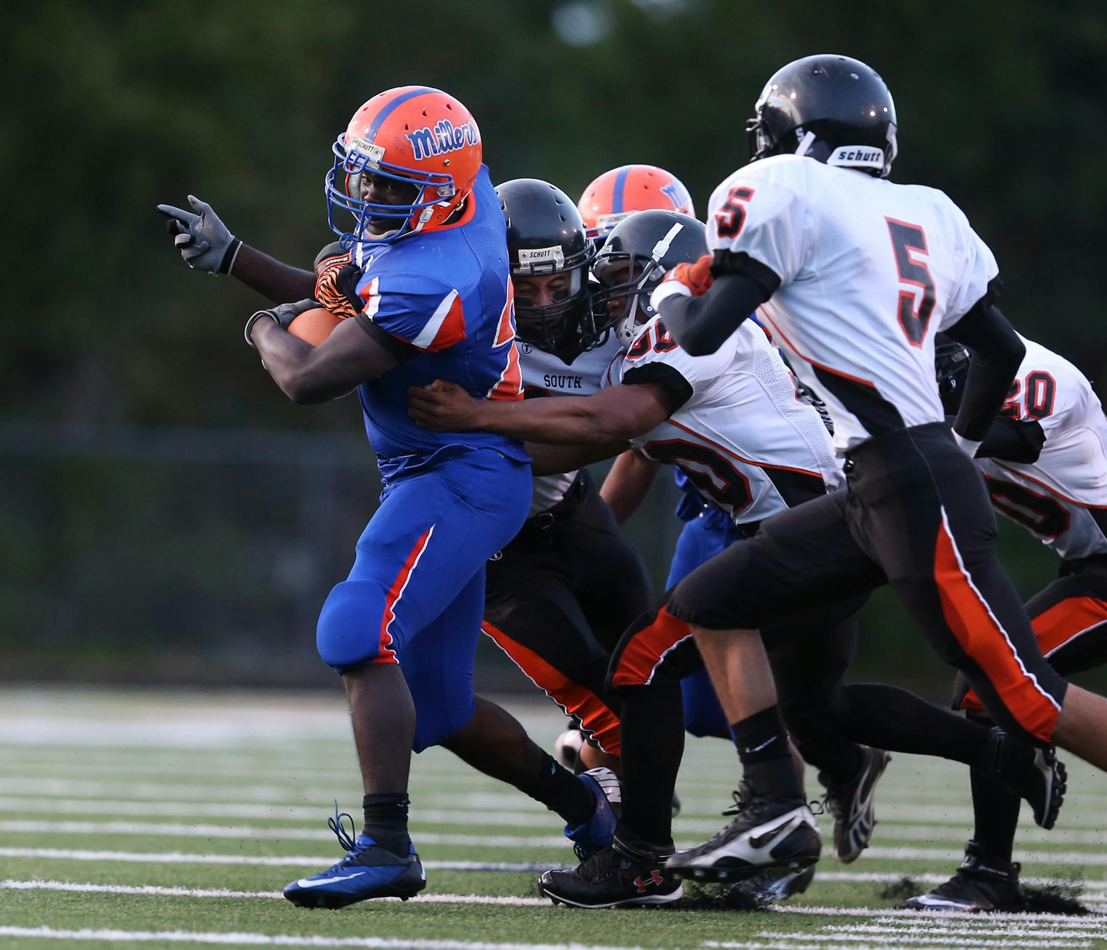 Washburn running back Raymonte Maynard was tackled by South high defenders durning high school football action between South High and Washburn in Minneapolis, Minnesota Friday September 7, 2012. ] Jerry Holt/ STAR TRIBUNE.COM)