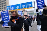 Sun Country flight attendants, who are in negotiations for a new contract, braved the cold weather and impending snowstorm for an informational picket