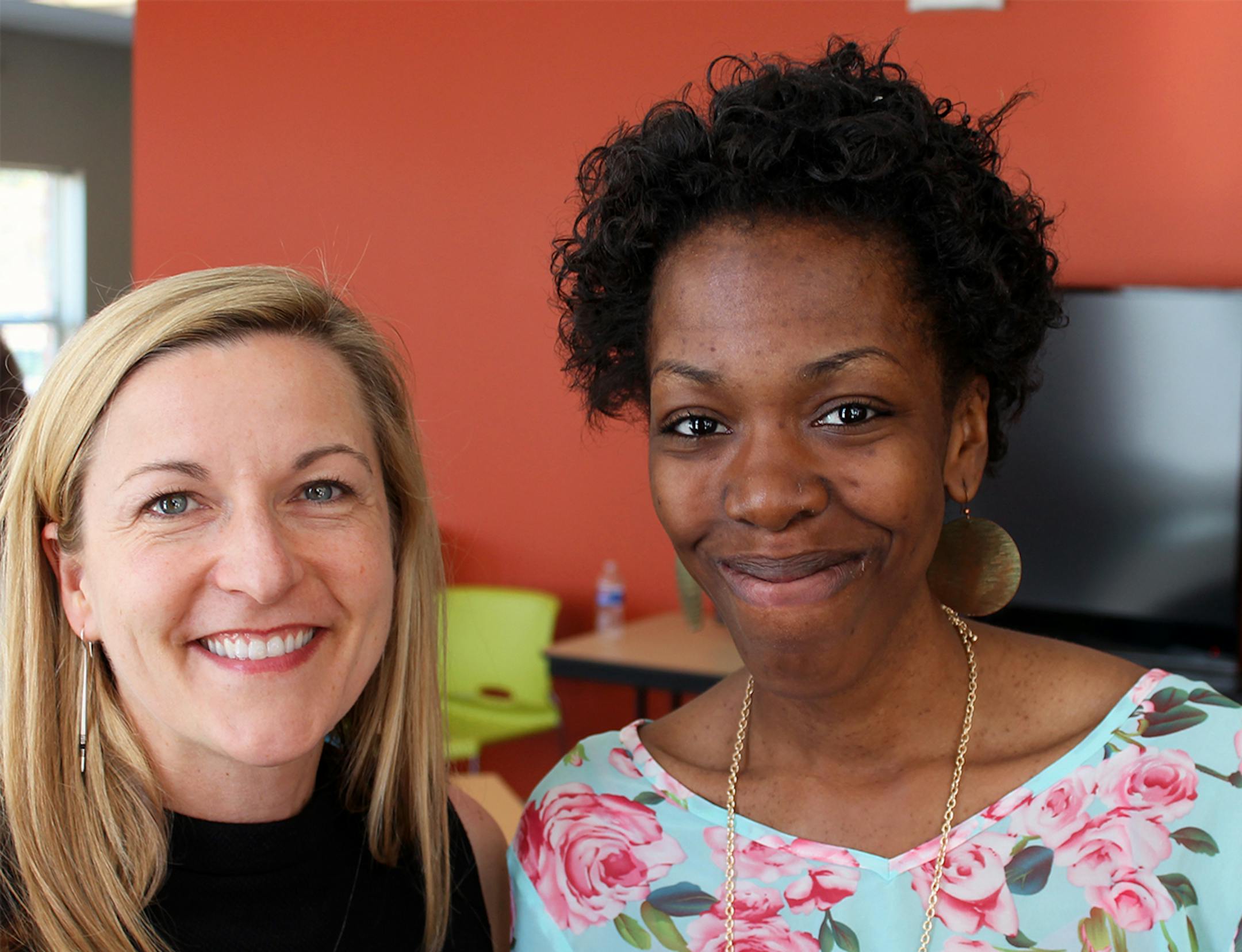 CommonBond CEO Deidre Schmidt (left) with Brittany Childs, one of the first residents at West Broadway Crescent.