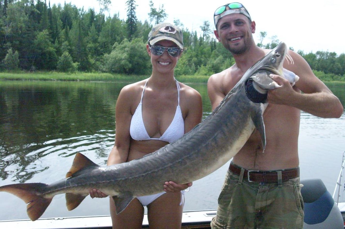 Brenna Burley and Josh Stanek of Grand Rapids caught a 56-inch sturgeon on the Rainy River near Baudette.