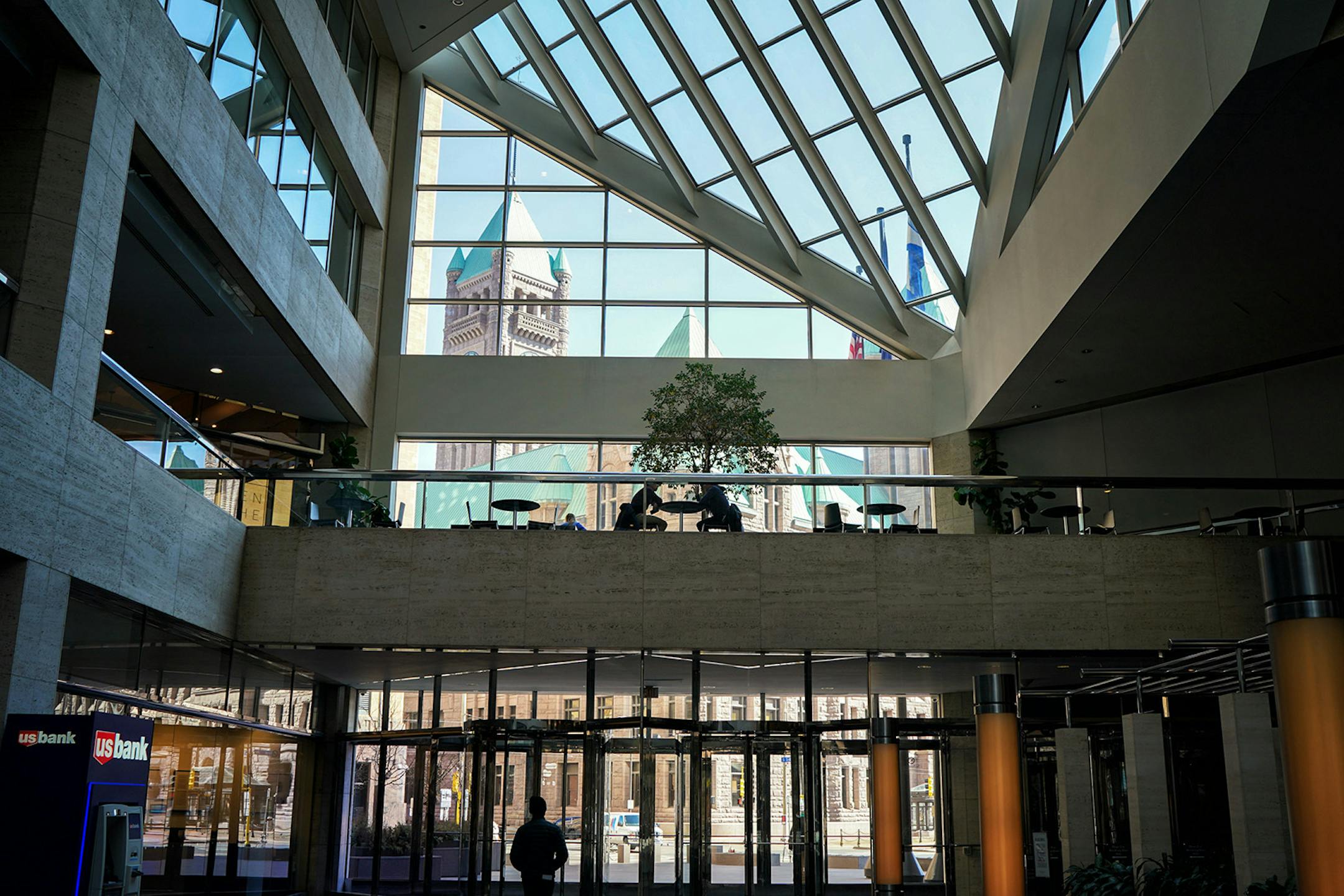 The USBancorp Center in downtown Minneapolis was unusually quiet for a weekday lunch hour. A few people were still moving around in downtown Minneapolis but nothing near the lunch hour weekday crowds.