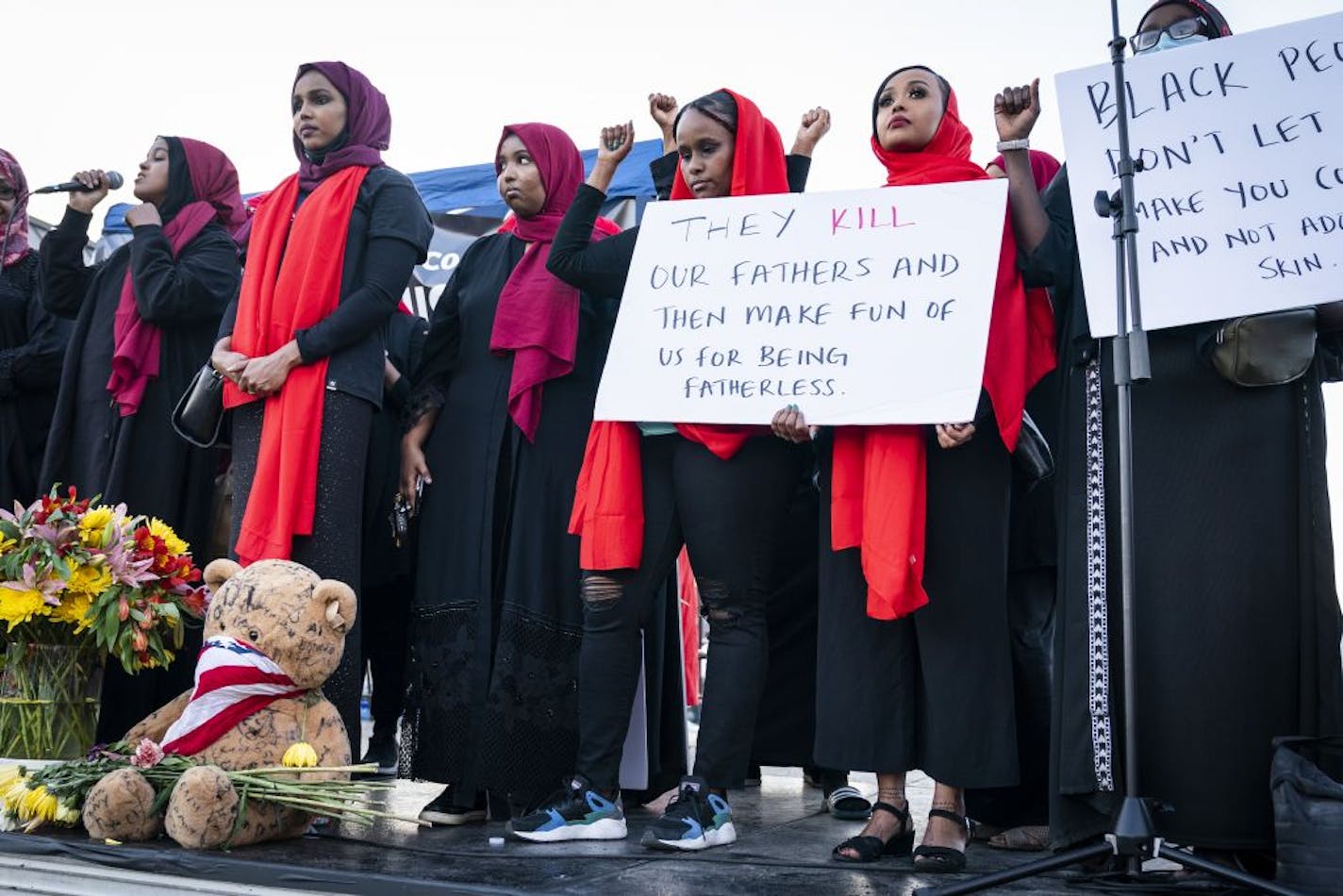 A group of Somali-American women spoke on stage in the early evening at the George Floyd memorial outside of Cup Foods.