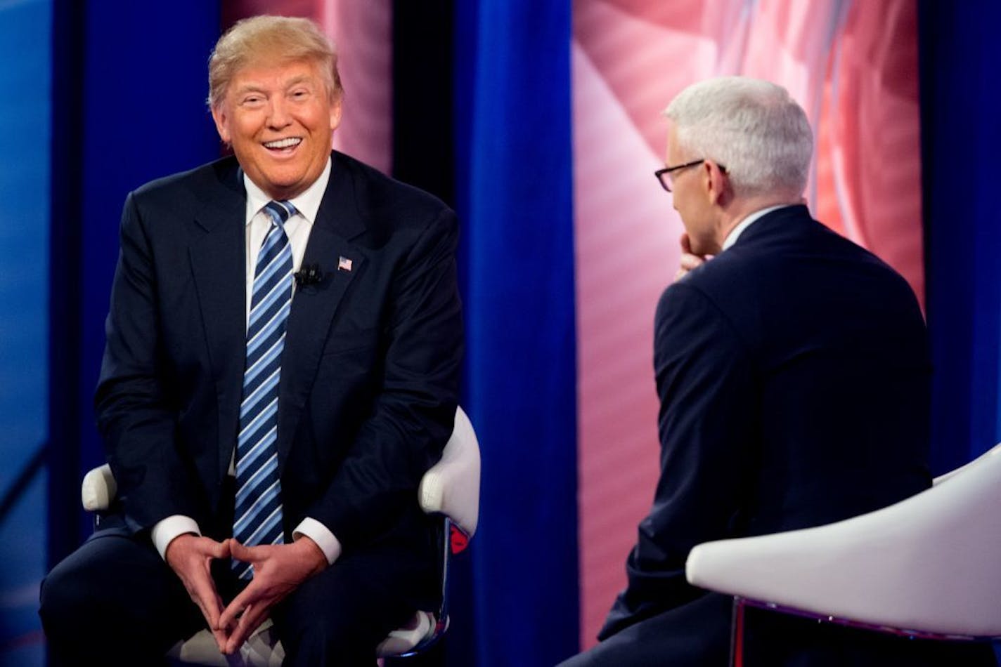 Republican presidential candidate Donald Trump laughed as he speaks with Anderson Cooper at a CNN town hall at the University of South Carolina in Columbia, S.C., on Thursday.