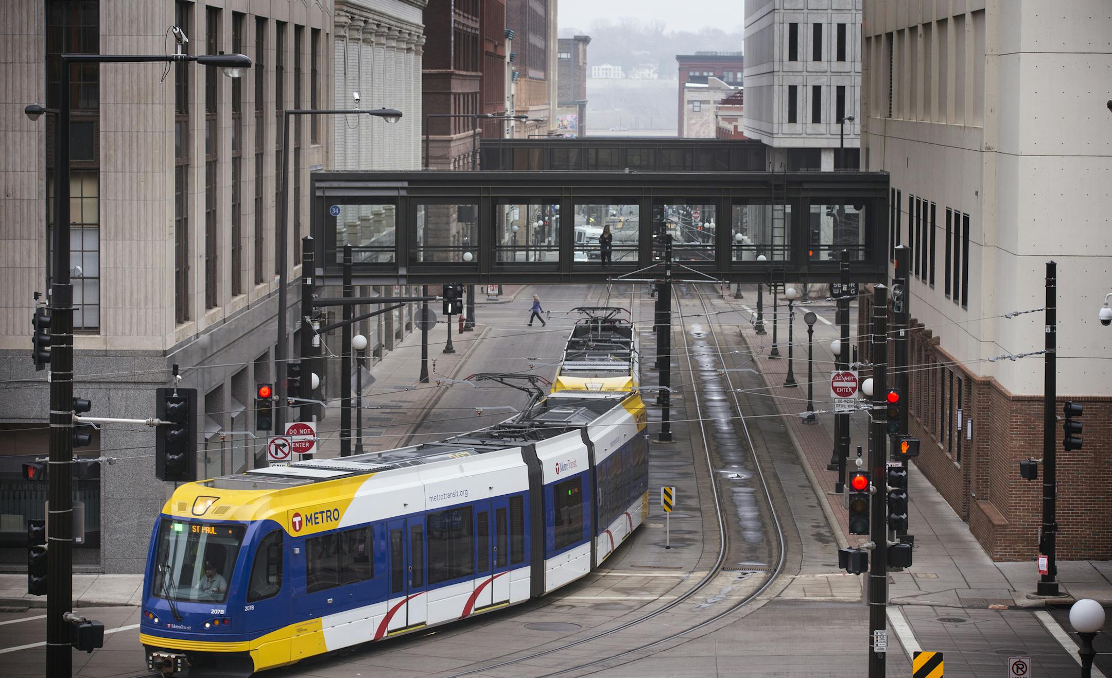 The Metro Green Line turns off 4th Street in downtown St. Paul. ] (Leila Navidi/Star Tribune) leila.navidi@startribune.com BACKGROUND INFORMATION: Monday, March 14, 2016 in downtown St. Paul. A group of building and business owners along the stretch of 4th Street in downtown St. Paul hope to change its status as a dead zone between bustling areas. On Monday they debuted a plan for what they call the 4th Street Market District. The members of the business community now hope city officials will bu
