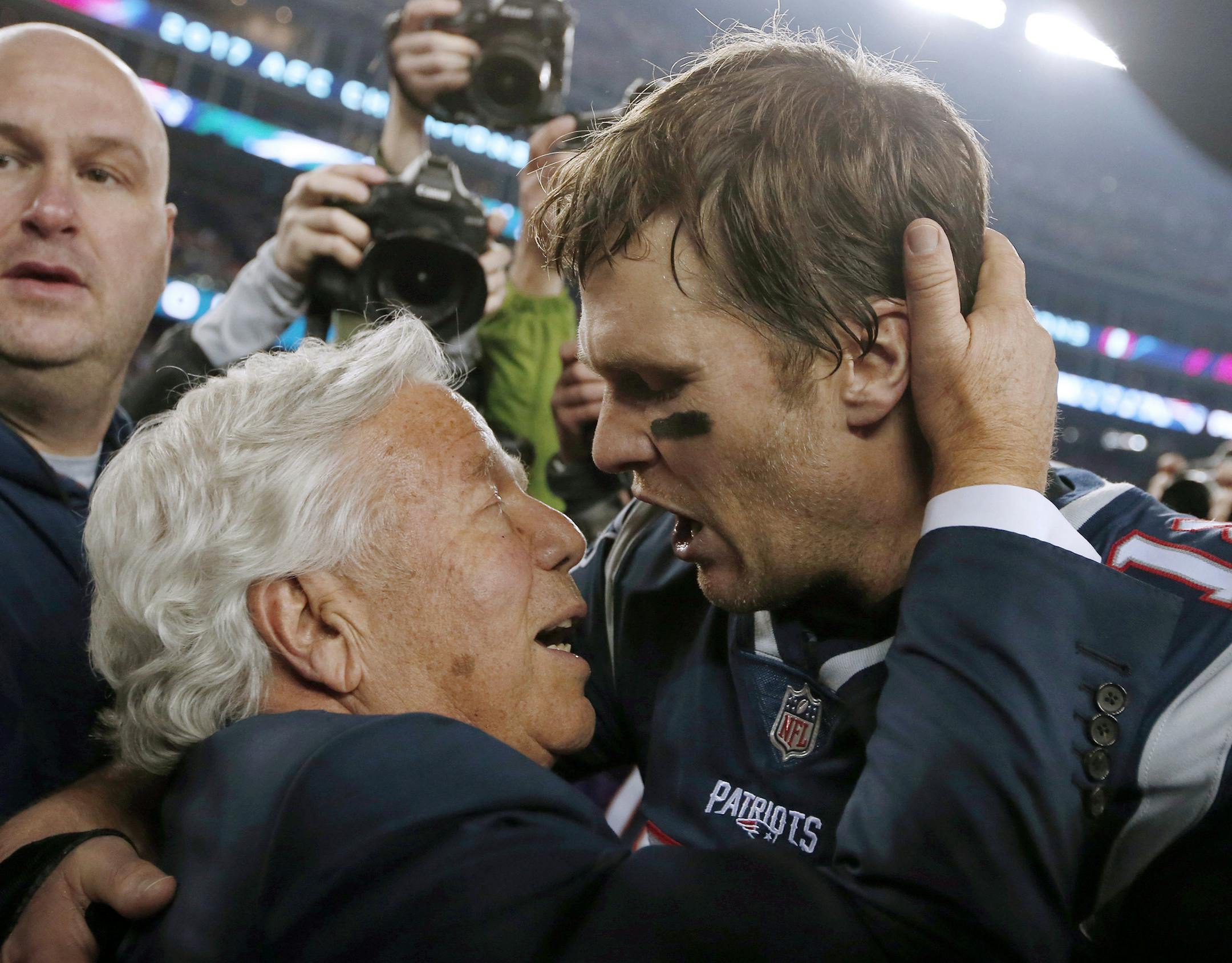 New England Patriots owner Robert Kraft, left, embraces quarterback Tom Brady after defeating the Jacksonville Jaguars in the AFC championship NFL football game, Sunday, Jan. 21, 2018, in Foxborough, Mass. The Patriots won 24-20. (AP Photo/Winslow Townson)