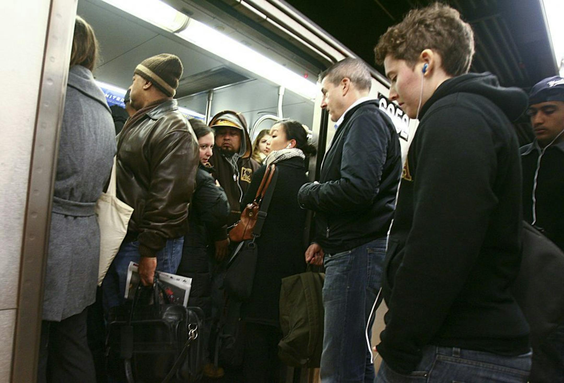 Morning commuters pack the No. 4 train at the Fulton Street subway station in the Manhattan borough of New York, Nov. 5, 2012. Some New Yorkers will be able to ride the subway all the way to their destinations Monday, as more lines opened after closures from Hurricane Sandy.