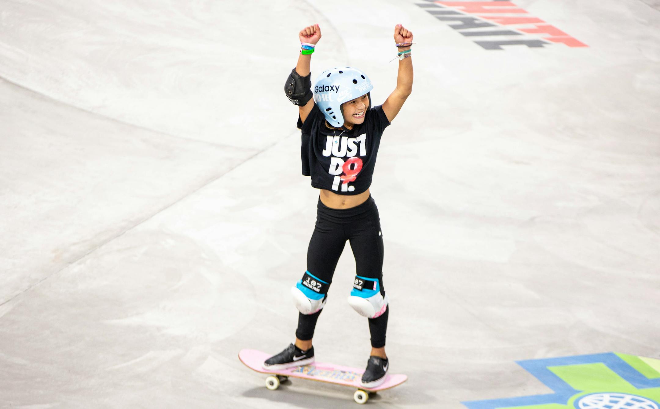 Sky Brown, 11, celebrates after maxing out her time on her first run during the Women's Skateboard Park qualifier round at the X Games at U.S. Bank Stadium