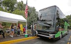 Passengers en route to the State Fair made their way onto a Southwest Transit double decker bus, Friday, August 29, 2014 in Eden Prairie, MN. The comp
