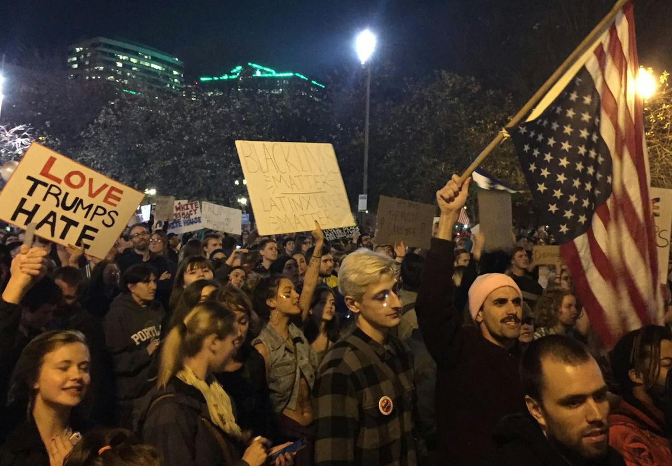 Protesters march on their way to Waterfront Park in Portland, Ore., on the third day of protests over the results of the 2016 U.S. presidential election, Thursday, Nov. 10, 2016. President-elect Donald Trump fired back on social media after demonstrators in both red and blue states hit the streets for another round of protests, showing outrage over the Republican's unexpected win. (Jim Ryan/The Oregonian via AP) ORG XMIT: MIN2016111814032230
