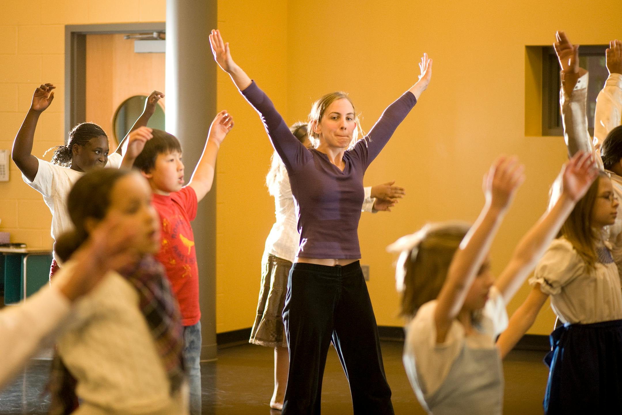 DAVID BREWSTER � dbrewster@startribune.com Thursday_10/30/08_Crystal FAIR school dance teacher Jenny Pennaz leads a 4th grade dance class through their warmups.