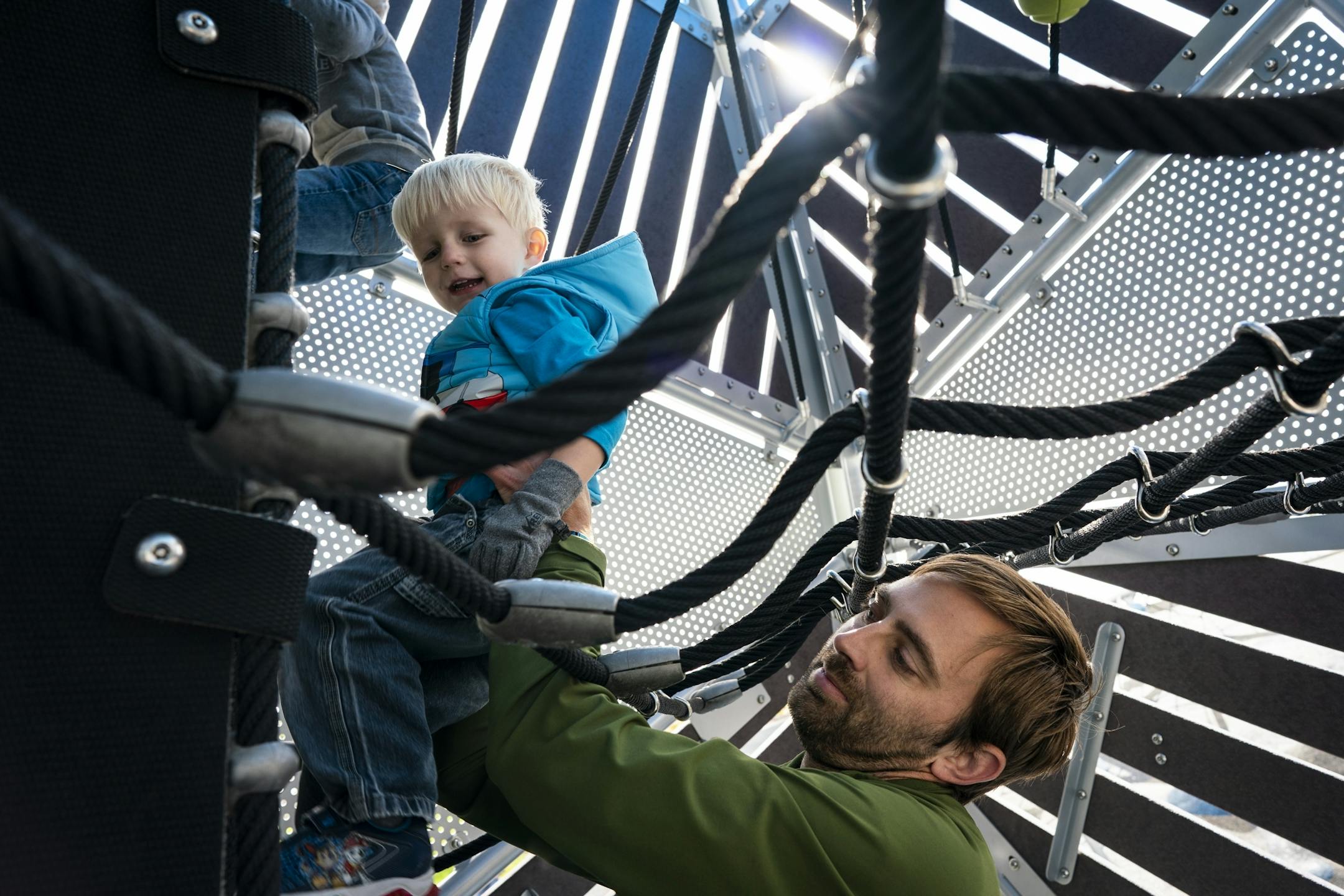 Keith Nagel plays with his son Sawyer, 3, during a Twin Cities Dads playgroup at Central Park in Maple Grove.