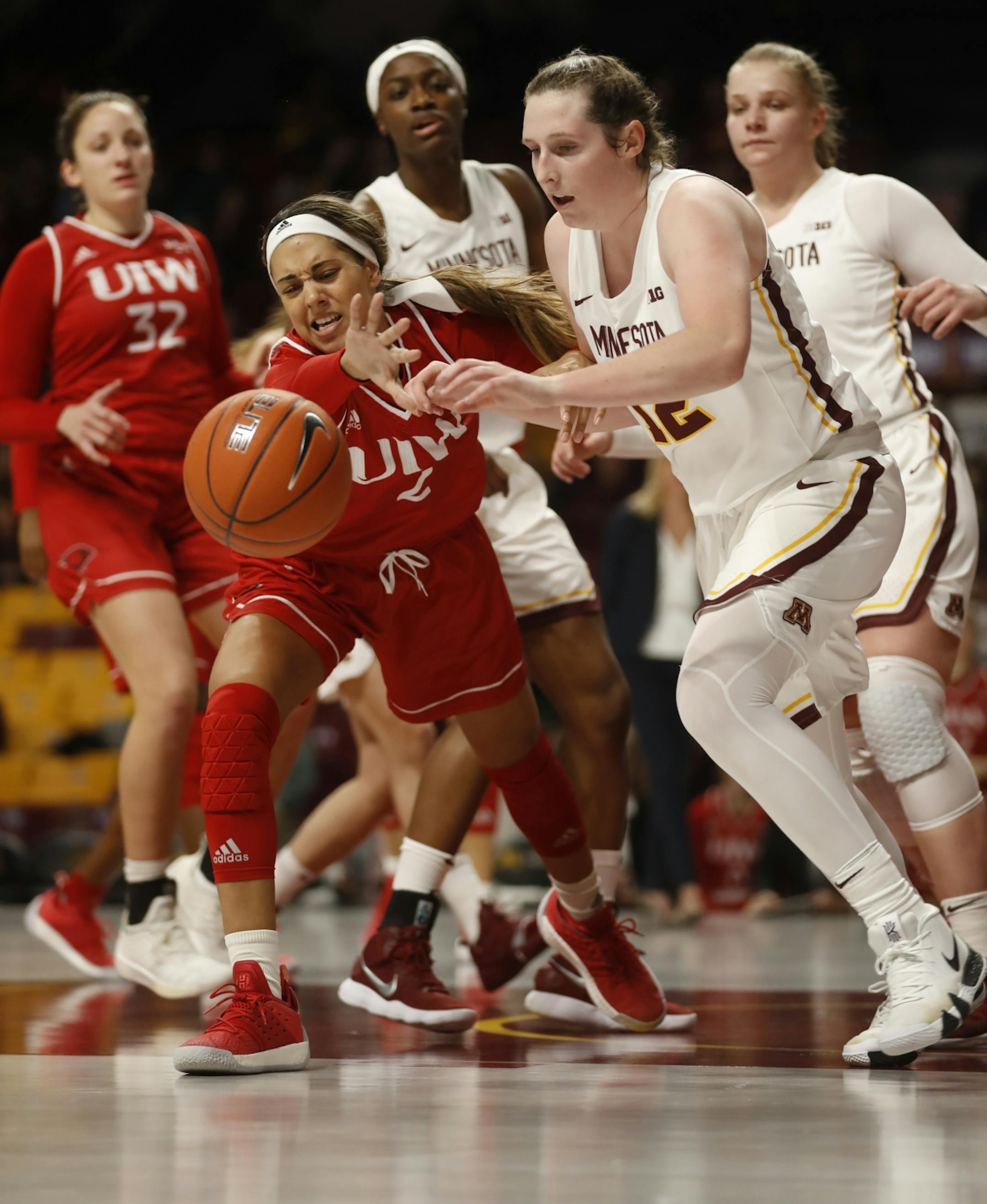 Lunden Henry(2) tries to get the ball away from Mercedes taples(12).