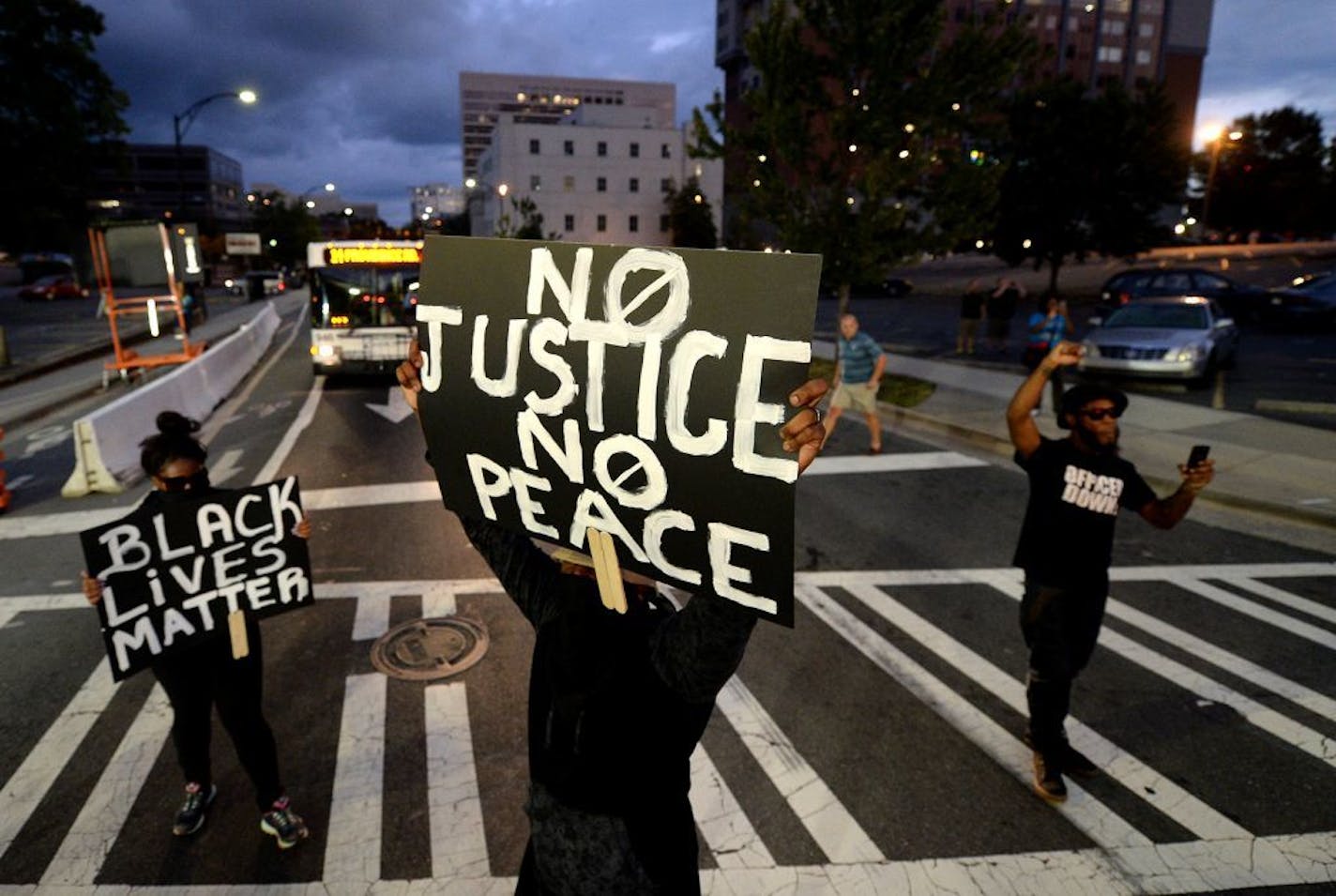 Protestors block an intersection near the Transit Center as they march uptown in Charlotte, N.C., on Wednesday, Sept. 21, 2016. The protestors were rallying against the fatal shooting of Keith Lamont Scott by police on Tuesday evening in the University City area.