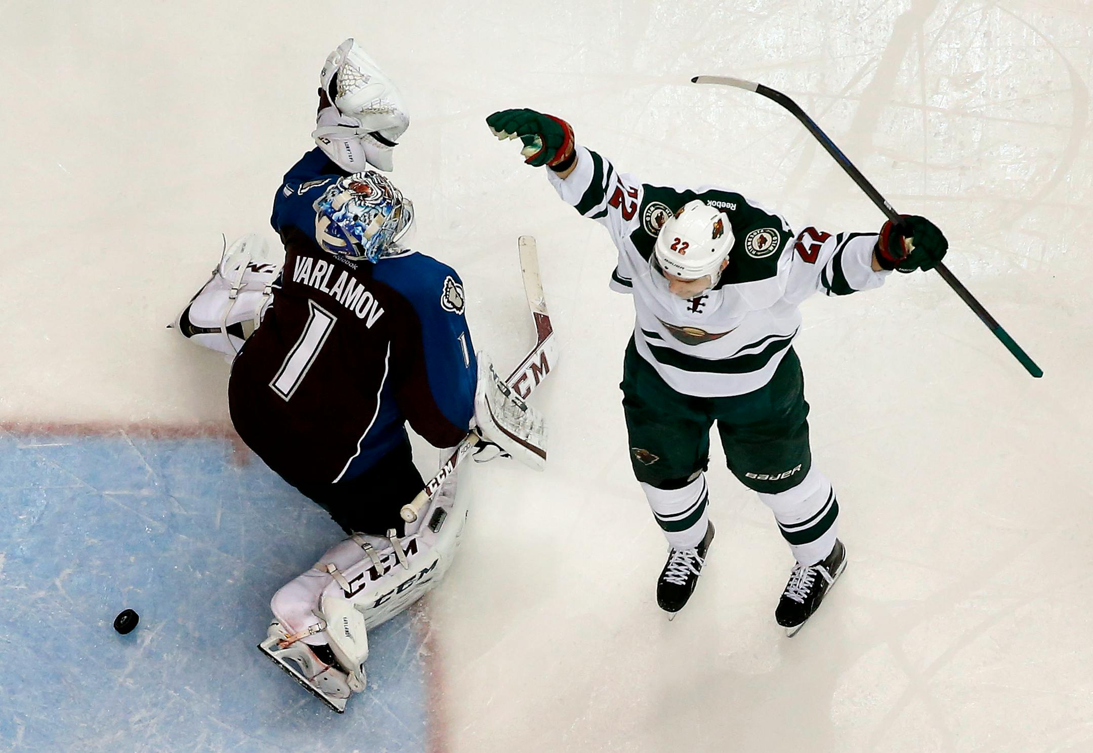Nino Niederreiter celebrated after shooting the puck past Colorado goalie Semyon Varlamov to score the game winning goal in overtime.