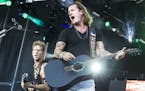 Tyler Hubbard, right, and Brian Kelley of Florida Georgia Line perform at the Luke Bryan Kick The Dust Up Tour at TCF Bank Stadium in Minneapolis June