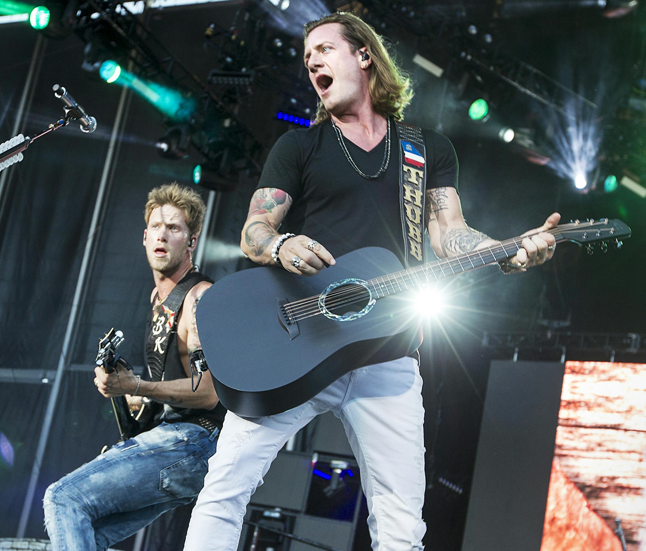 Tyler Hubbard, right, and Brian Kelley of Florida Georgia Line perform at the Luke Bryan Kick The Dust Up Tour at TCF Bank Stadium in Minneapolis June 20, 2015. (Courtney Perry/Special to the Star Tribune)