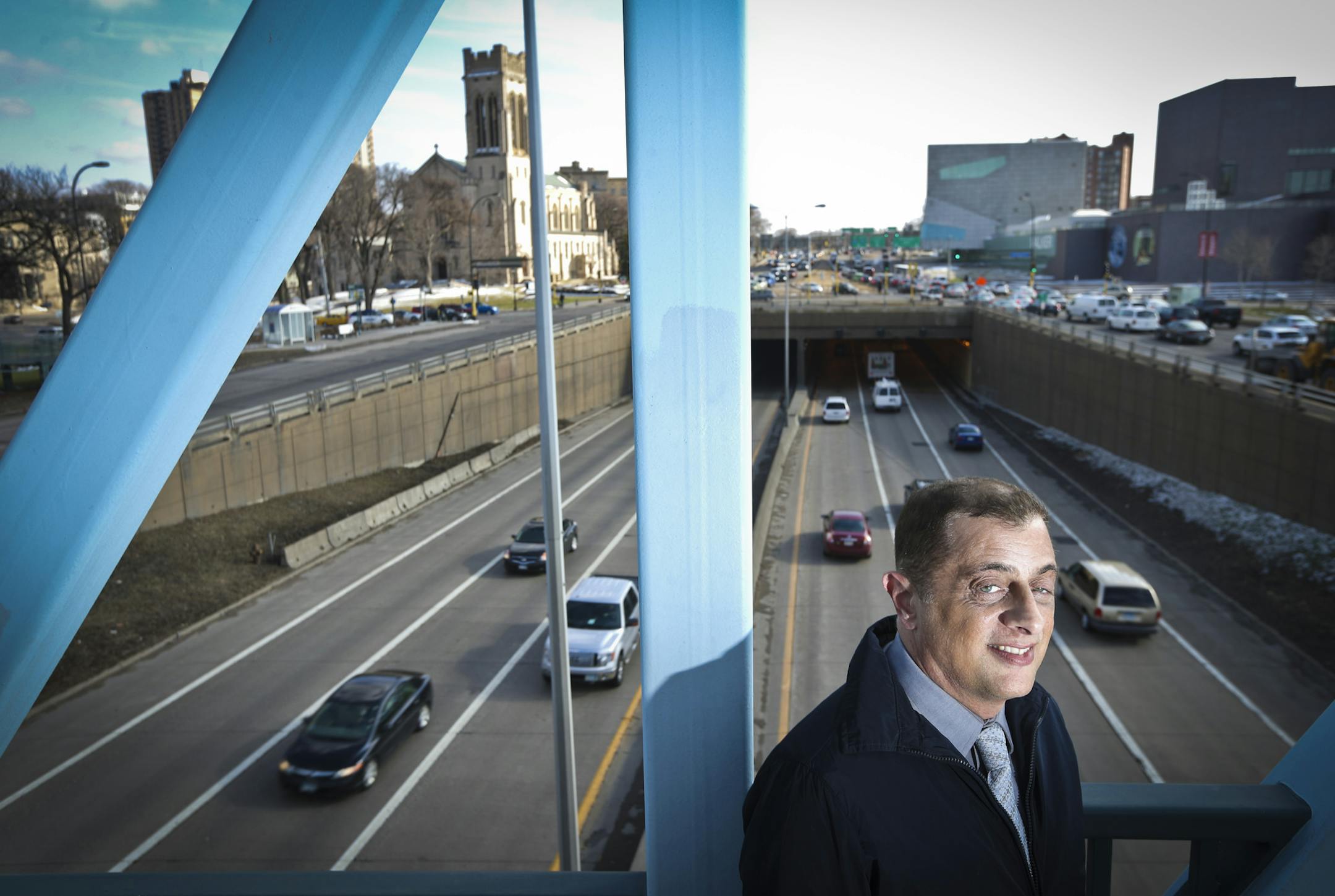 John Van Heel, a Loring Park neighborhood organization board member, stood on the bridge overlooking the Hennepin-Lyndale bottleneck intersection near Loring Park and the Walker Art Museum in Minneapolis, Minn., on Thursday, April 17, 2014. ] RENEE JONES SCHNEIDER • (reneejones@startribune.com)
