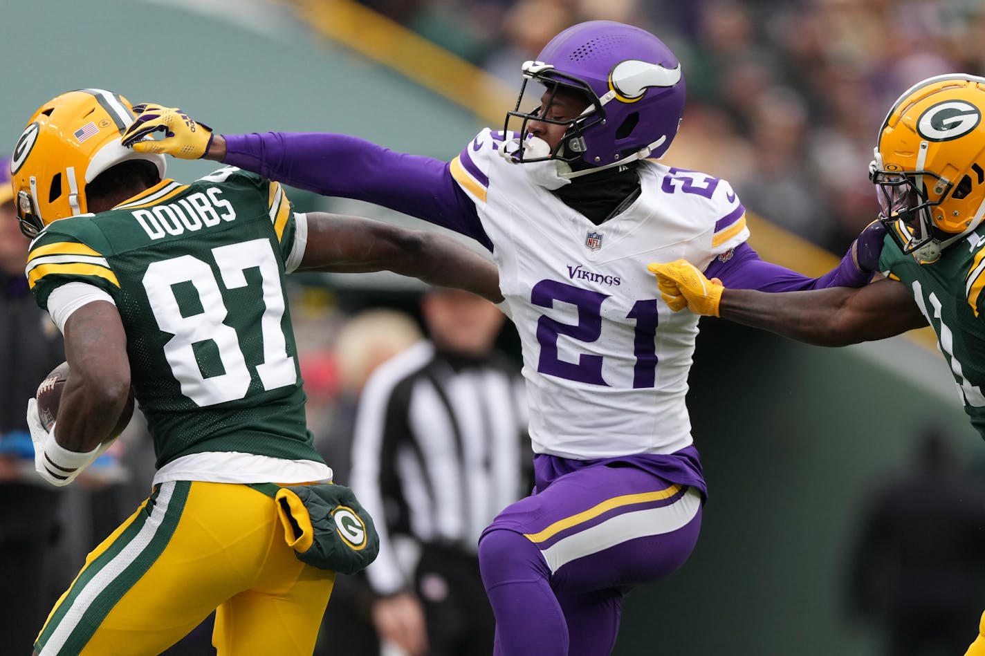 Green Bay Packers wide receiver Romeo Doubs (87) is forced out by Minnesota Vikings cornerback Akayleb Evans (21) in the first quarter of an NFL game between the Minnesota Vikings and the Green Bay Packers Sunday, Oct. 29, 2023 at Lambeau Field in Green Bay, Wis. ] ANTHONY SOUFFLE • anthony.souffle@startribune.com