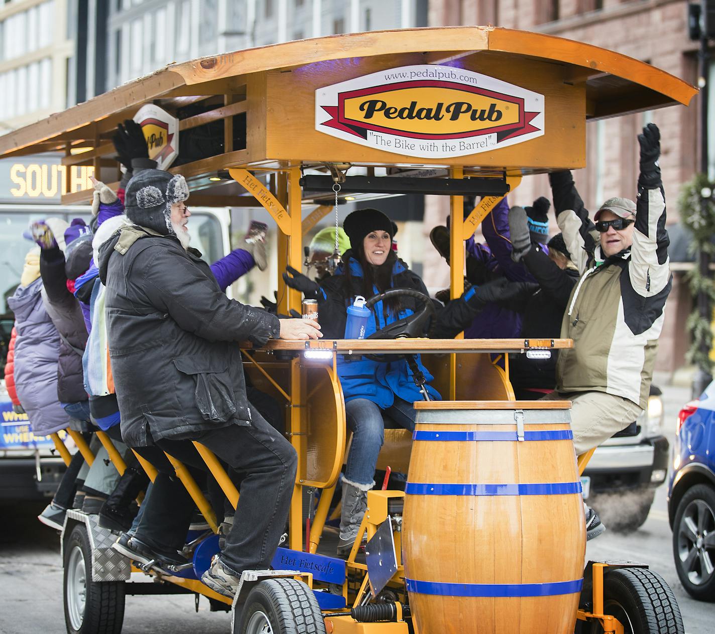 Riders do the Skol chant while riding in the Peddle Pub. ] LEILA NAVIDI &#xef; leila.navidi@startribune.com BACKGROUND INFORMATION: Peddle Pub goes for the first of their special winter rides for Super Bowl week on Tuesday, January 30, 2018 in downtown Minneapolis.