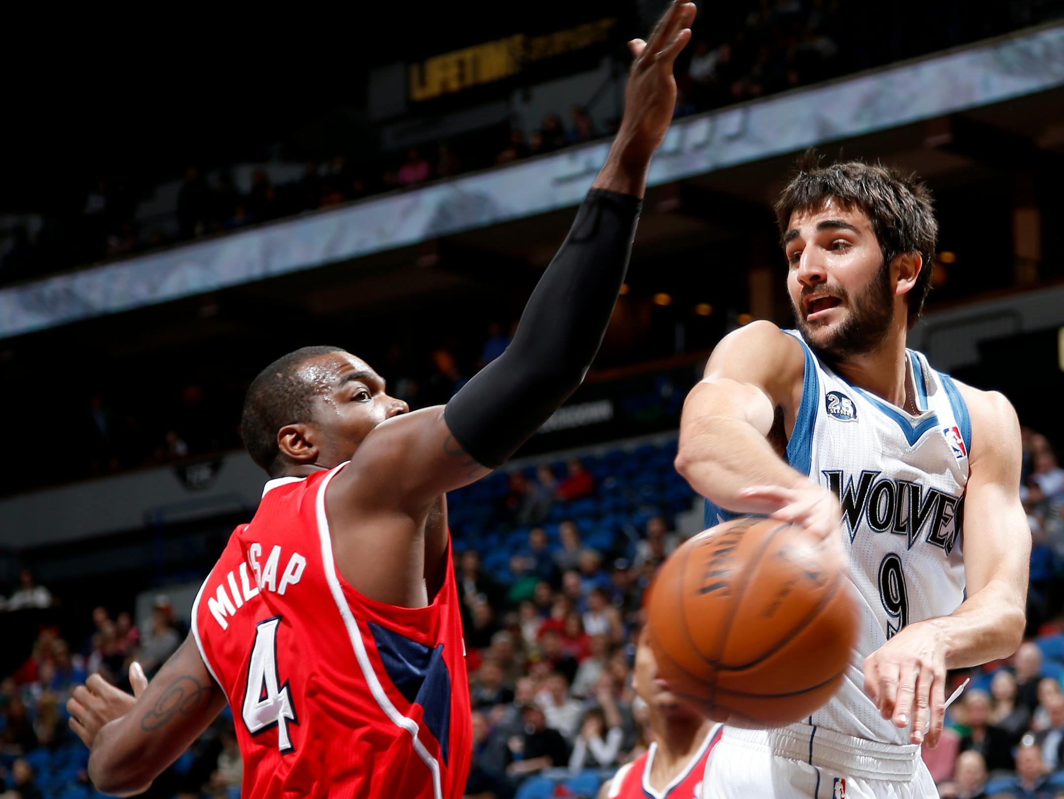 Ricky Rubio passed the ball past Paul Millsap in the first quarter.