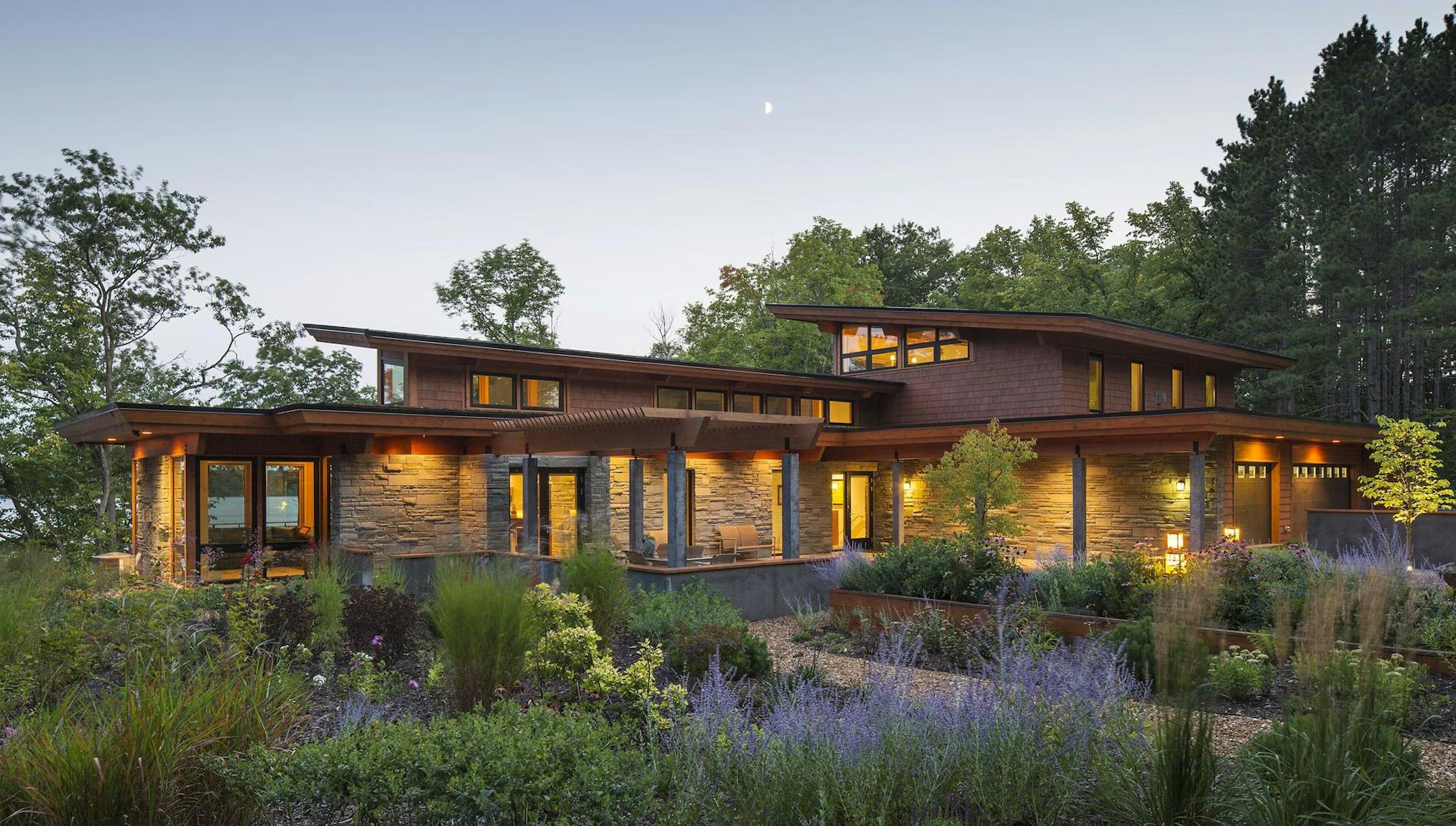 This modern interpretation of a prairie-style home, designed by Katherine Hillebrand of SALA Architects, features a pop-up roof with clerestory windows.