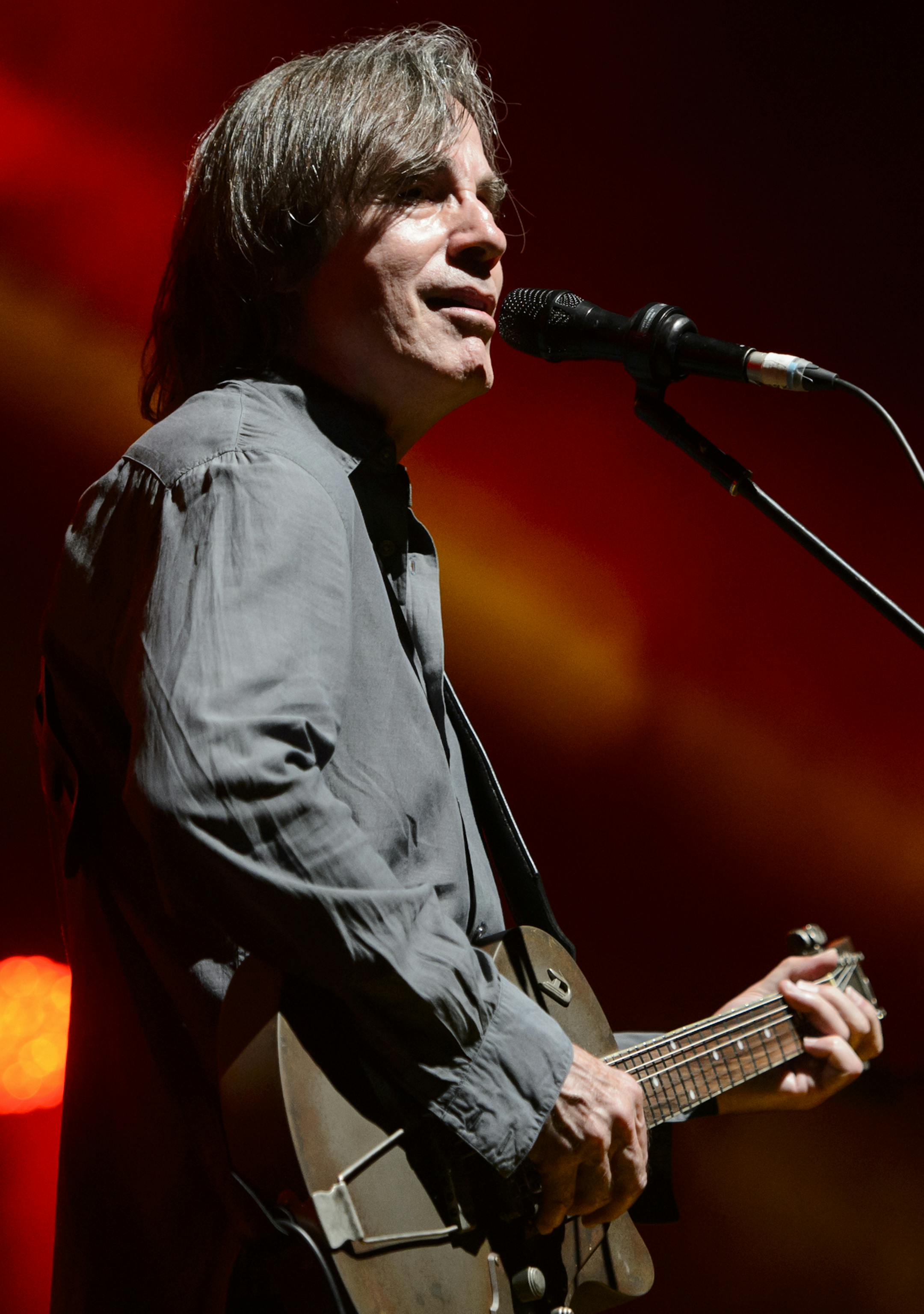 In this Saturday July 4, 2015 picture US singer Jackson Browne performs on the Stravinski Hall stage at the 49th Montreux Jazz Festival, in Montreux, Switzerland, (Jean-Christophe Bott/Keystone via AP)