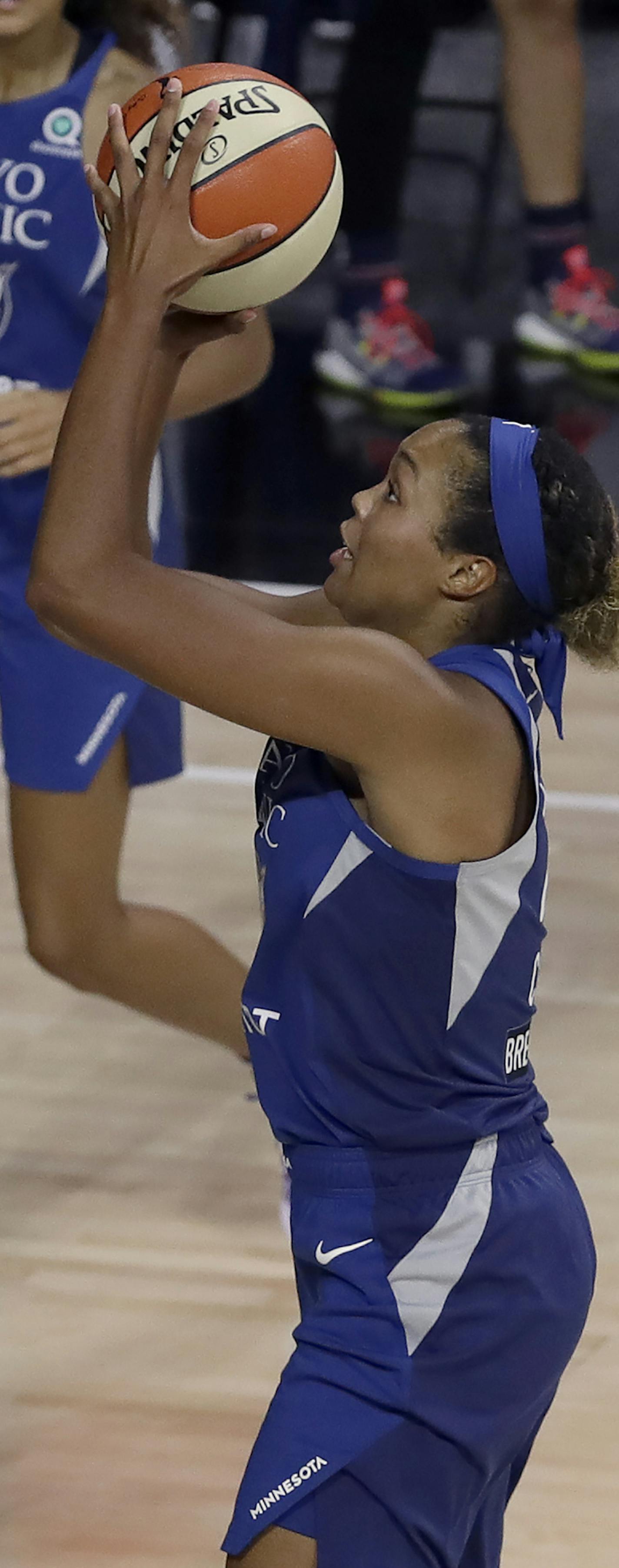 Minnesota Lynx forward Napheesa Collier (24) shoots over Chicago Sky guard Kahleah Copper (2) and forward Gabby Williams (15) during the first half of a WNBA basketball game Thursday, July 30, 2020, in Bradenton, Fla. (AP Photo/Chris O'Meara)