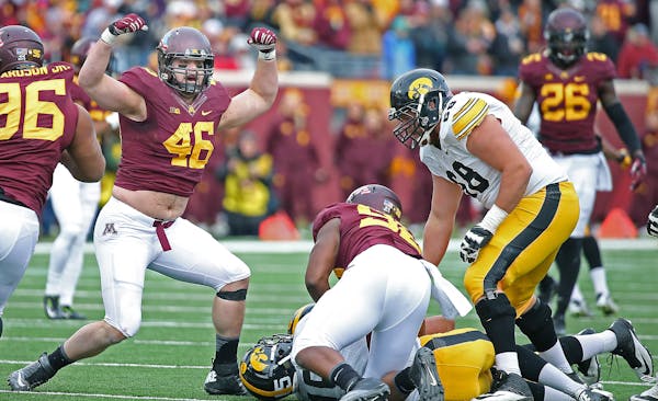 Minnesota's defensive lineman Cameron Botticelli (46) celebrated a sack in the third quarter as the Gophers took on the Iowa Hawkeyes, Saturday, Novem
