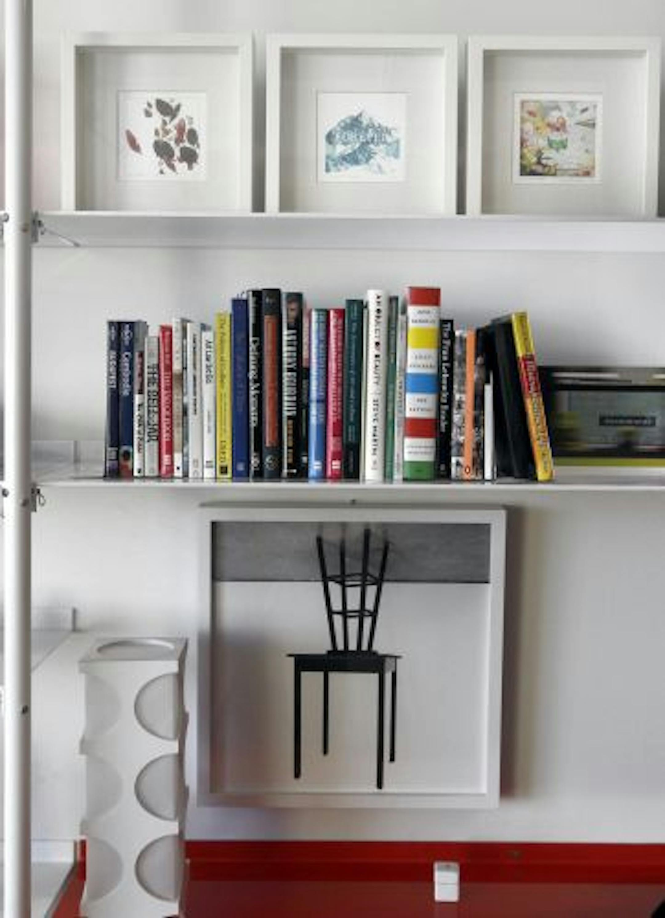 Michael Jones' custom bookcase has a few books.