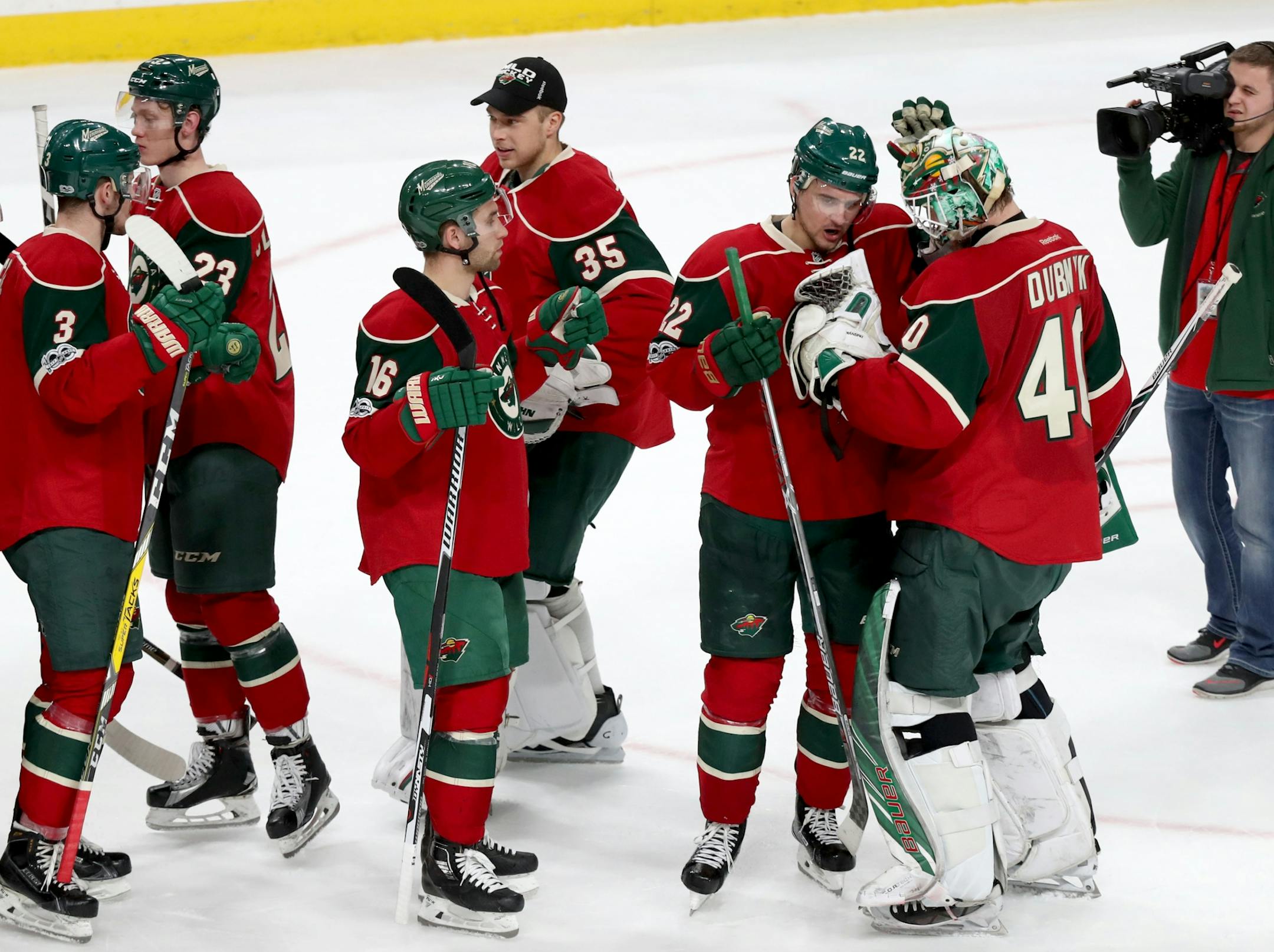 Minnesota Wild goalie Devan Dubnyk (40) gets congratulations from teammates after the Wild's 2-1 shootout win over Tampa Bay Friday, Feb. 10, 2017, at the Xcel Energy Center in St. Paul, MN.