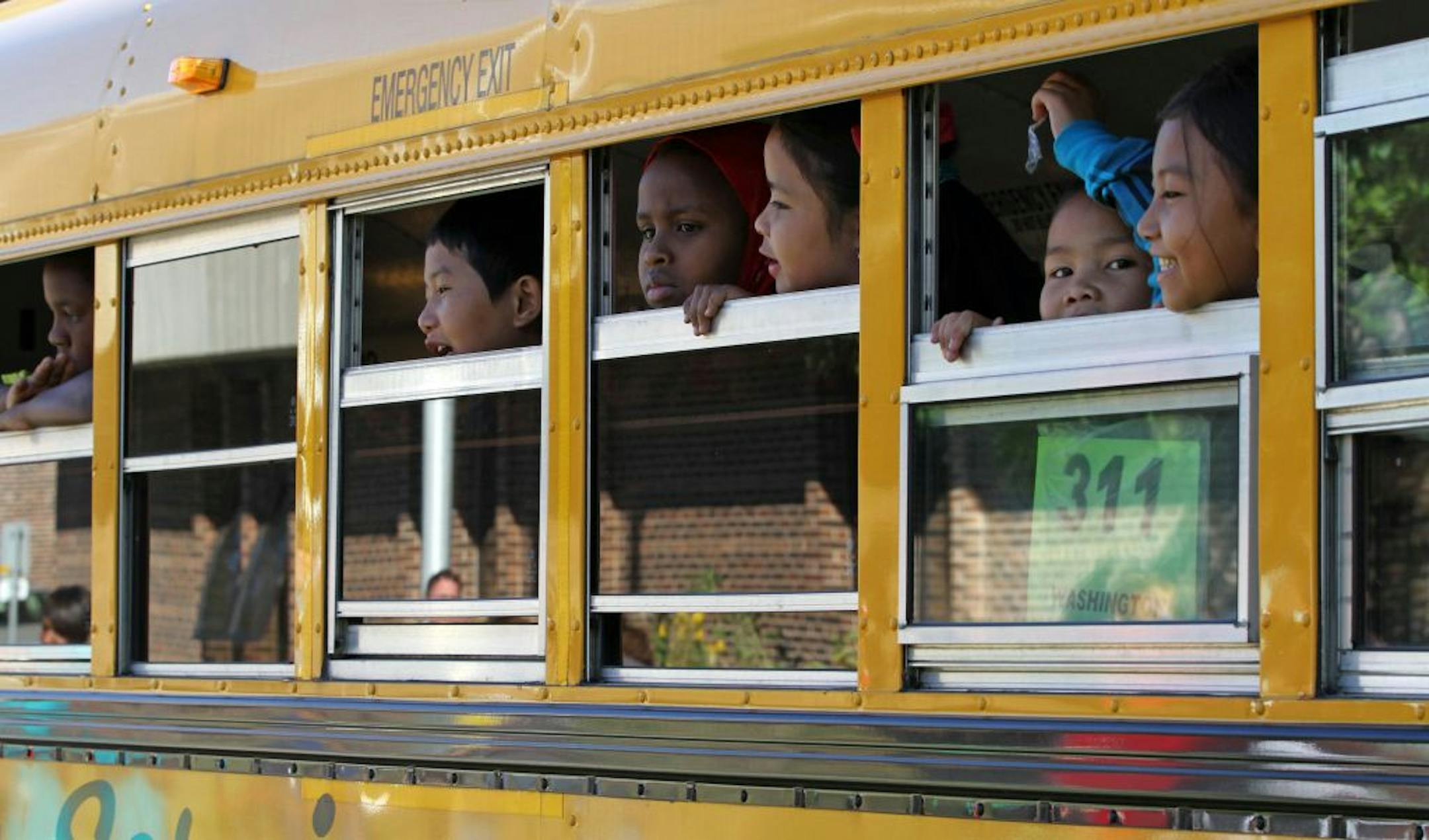 Barack and Michelle Obama Service Learning Elementary School students in St. Paul boarded the bus for home at the end of the first day of school on Tuesday, 9/6/2011. 655 kids go to the St. Paul school and the students are wearing uniforms for the first time at the school. Bruce Bisping/Star Tribune.
