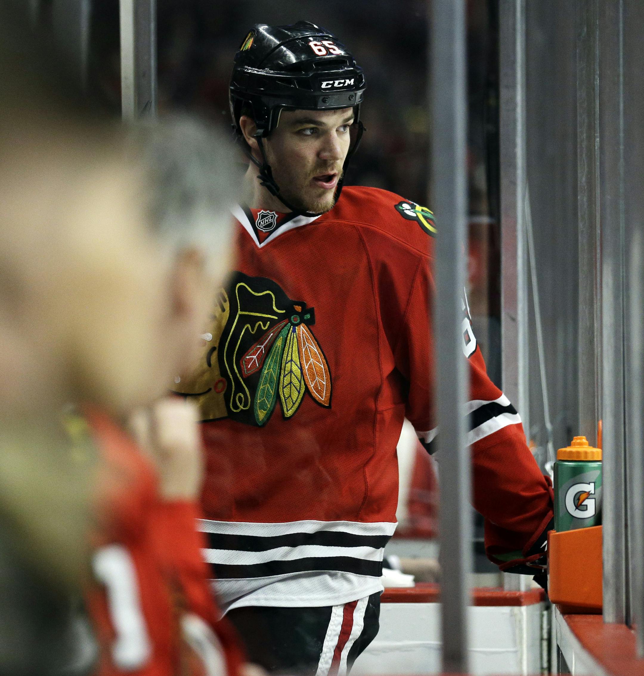 Chicago Blackhawks' Andrew Shaw (65) watches his teammates during the first period in Game 1 of an NHL hockey second-round playoff series against the Minnesota Wild in Chicago, Friday, May 2, 2014. (AP Photo/Nam Y. Huh) ORG XMIT: MIN2014050420090653