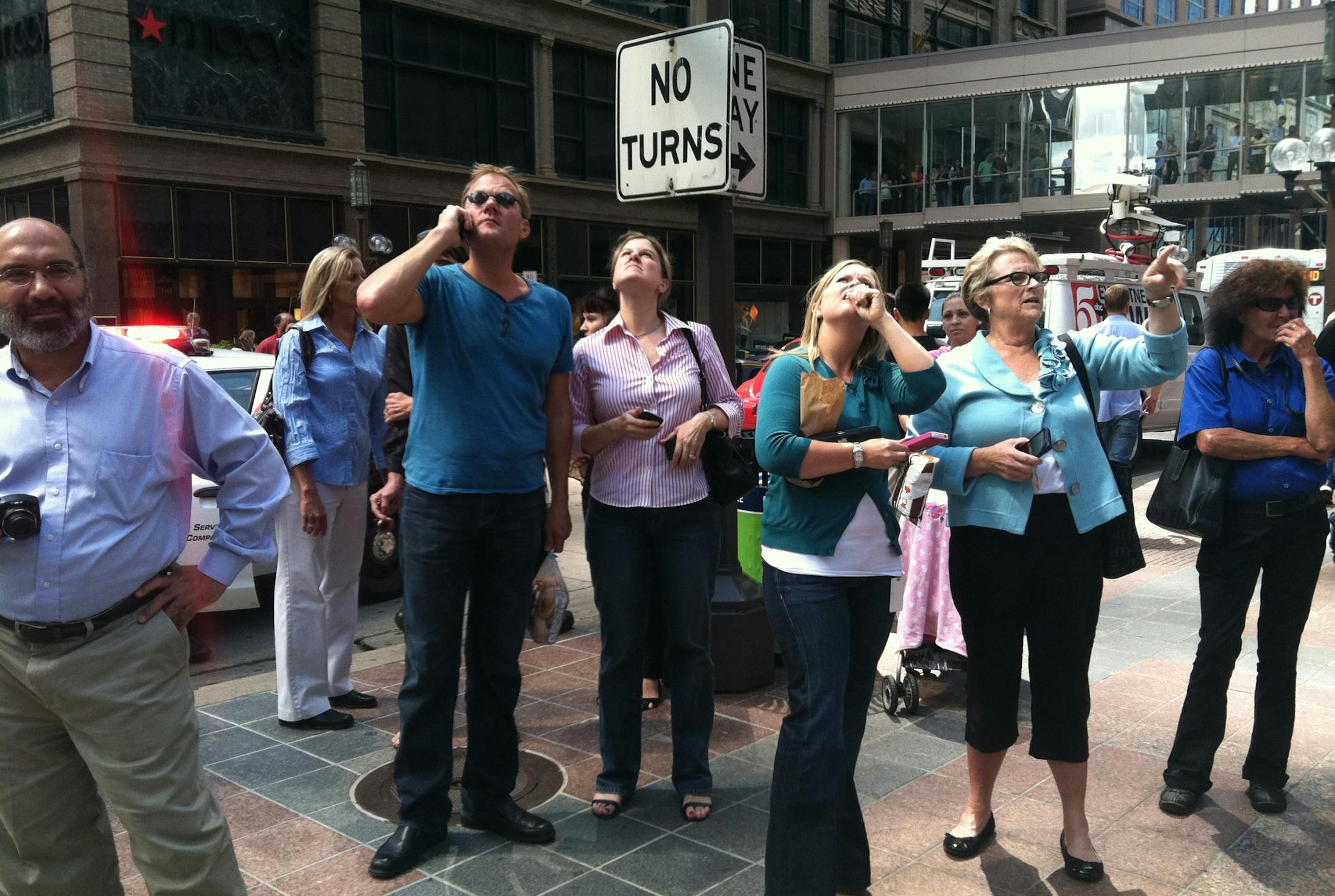 Bystanders in downtown Minneapolis after the M&I Bank was evacuated, and traffic shutdown on Nicollet Mall between 5th and 7th on Friday.