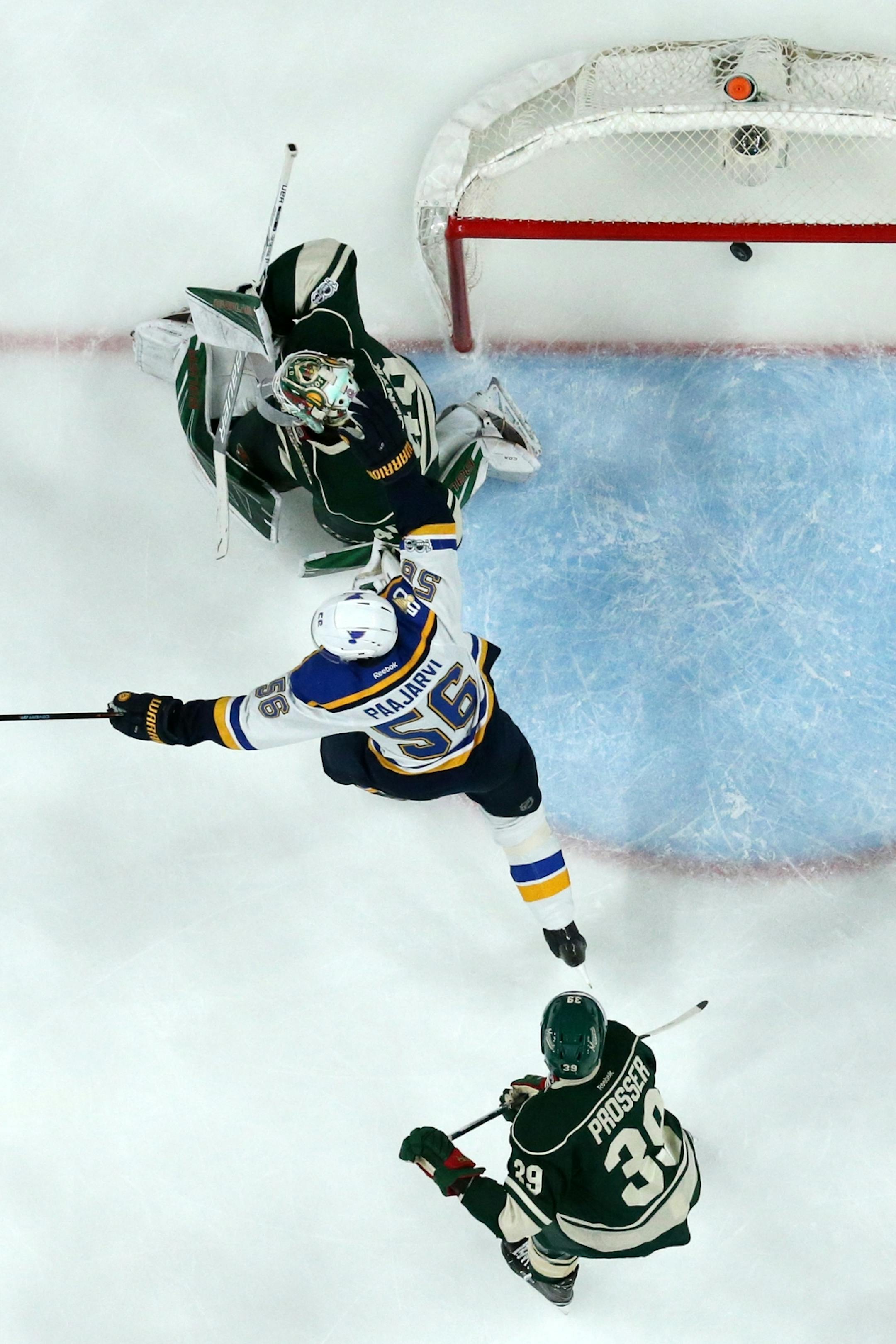 St. Louis Blues left wing Magnus Paajarvi (56) celebrated the St. Louis Blues second goal of the game on Minnesota Wild goalie Devan Dubnyk (40) in the first period.