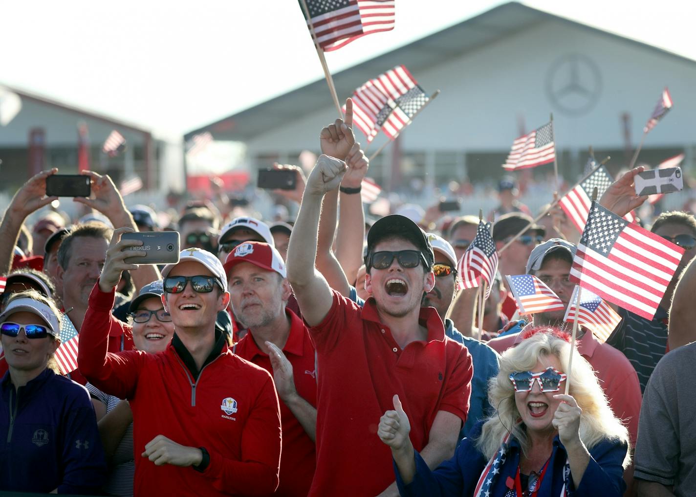 USA fans cheer during the Ryder Cup ceremony.