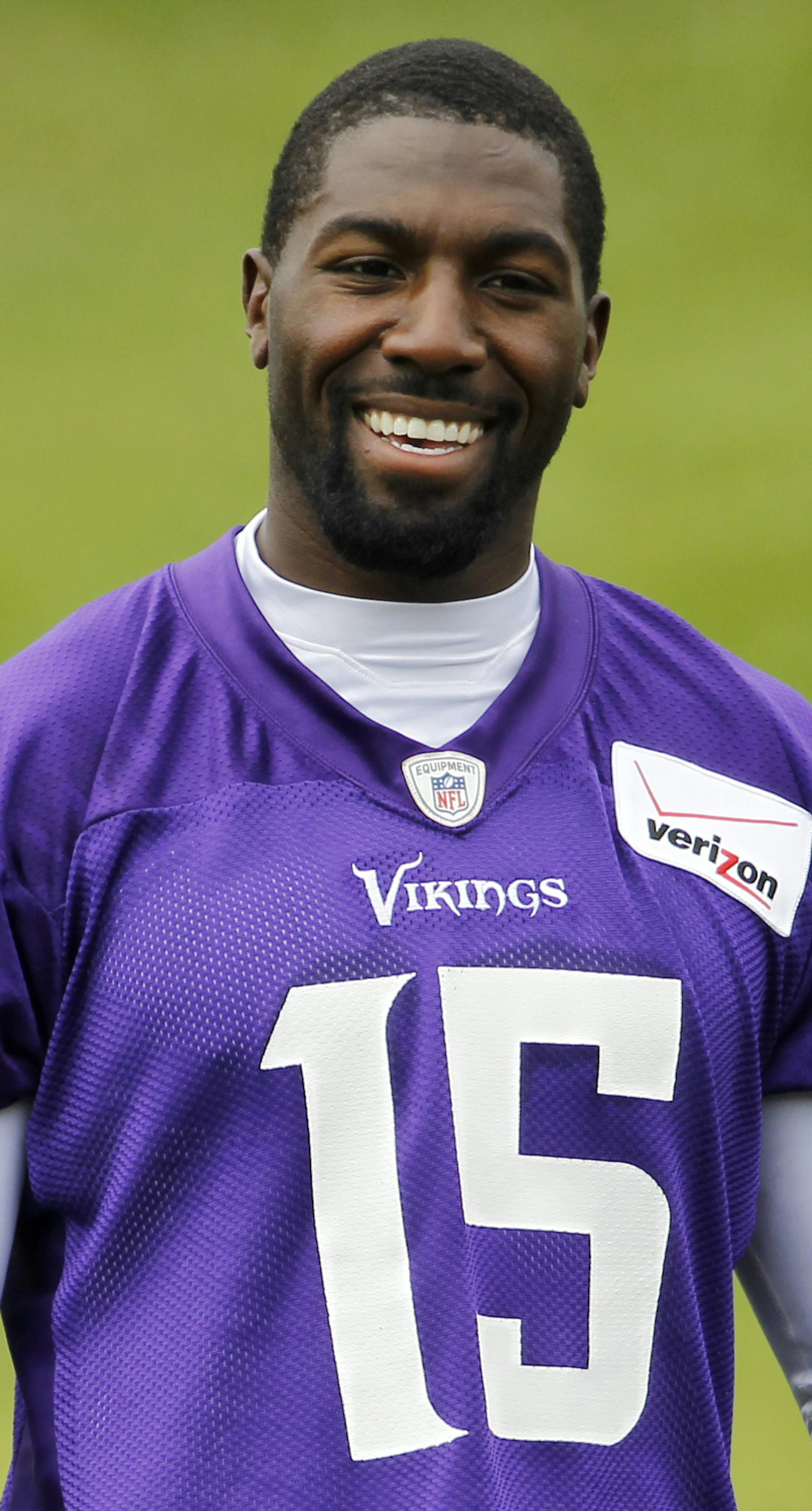 Minnesota Vikings wide receiver Greg Jennings (15) talks with quarterbacks Christian Ponder (7) and Teddy Bridgewater (5) during an NFL organized training activity in Eden Prairie, Minn., Wednesday, June 11, 2014. (AP Photo/Ann Heisenfelt) ORG XMIT: MIN2014072318405900