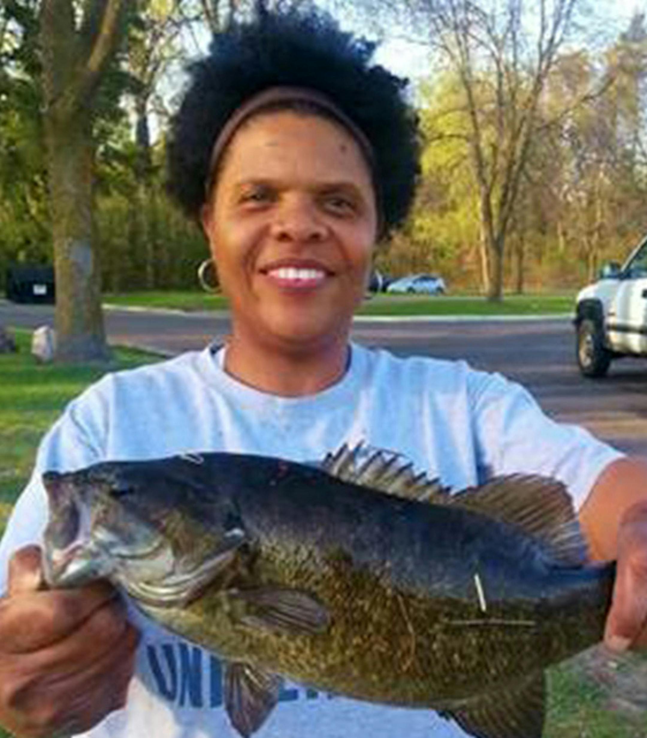 LUCKY STRIKE Jo Jackson of Brooklyn Park caught and released this dandy smallmouth bass off the boat ramp at the Coon Rapids Dam on the Mississippi River. "I was fishing for panfish on the shore, and had a bobber on my line,'' she said. "Then I walked over to the dock, took off my bobber and my line dropped into the water.'' And the big bass hit.