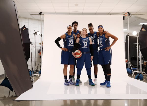 Lynx team photographer David Sherman photographed a group portrait of players, from left, forward Maya Moore (23), center Sylvia Fowles (34), guard Li
