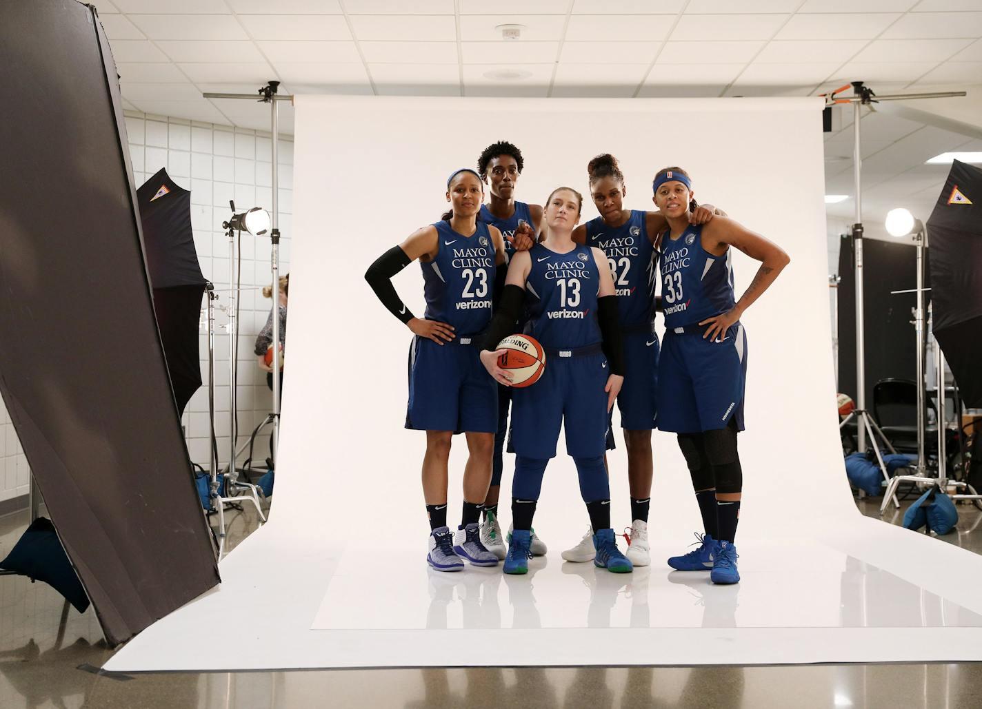 Lynx team photographer David Sherman photographed a group portrait of players, from left, forward Maya Moore (23), center Sylvia Fowles (34), guard Lindsay Whalen (13), forward Rebekkah Brunson (32), and guard Seimone Augustus (33) (behind Sherman). ] ANTHONY SOUFFLE &#xef; anthony.souffle@startribune.com The Minnesota Lynx WNBA team held a media day Wednesday, May 16, 2018 at the Target Center in Minneapolis.