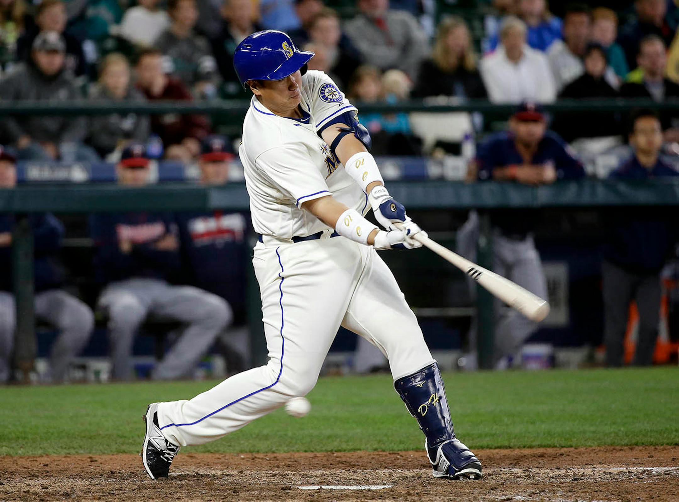 Seattle Mariners' Dae-Ho Lee swings and misses to strike out and end a baseball game against the Minnesota Twins in the ninth inning Sunday, May 29, 2016, in Seattle.