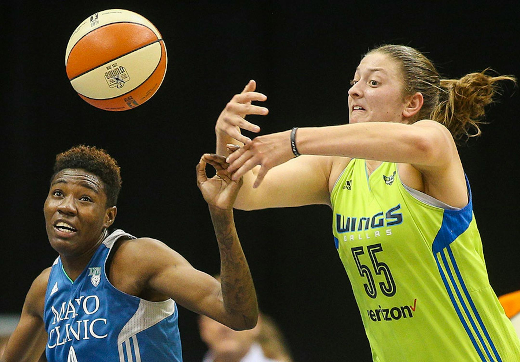 Minnesota Lynx forward Natasha Howard (3) and Dallas Wings forward Theresa Plaisance (55) contest for a loose ball.