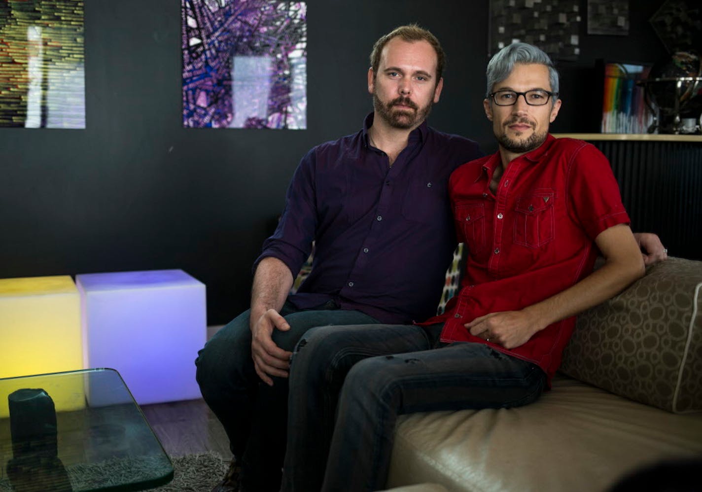 Charlie Craig, left, and David Mullins at their home in Denver, Aug. 24, 2017. A baker's refusal to bake their wedding cake led to a Supreme Court showdown.