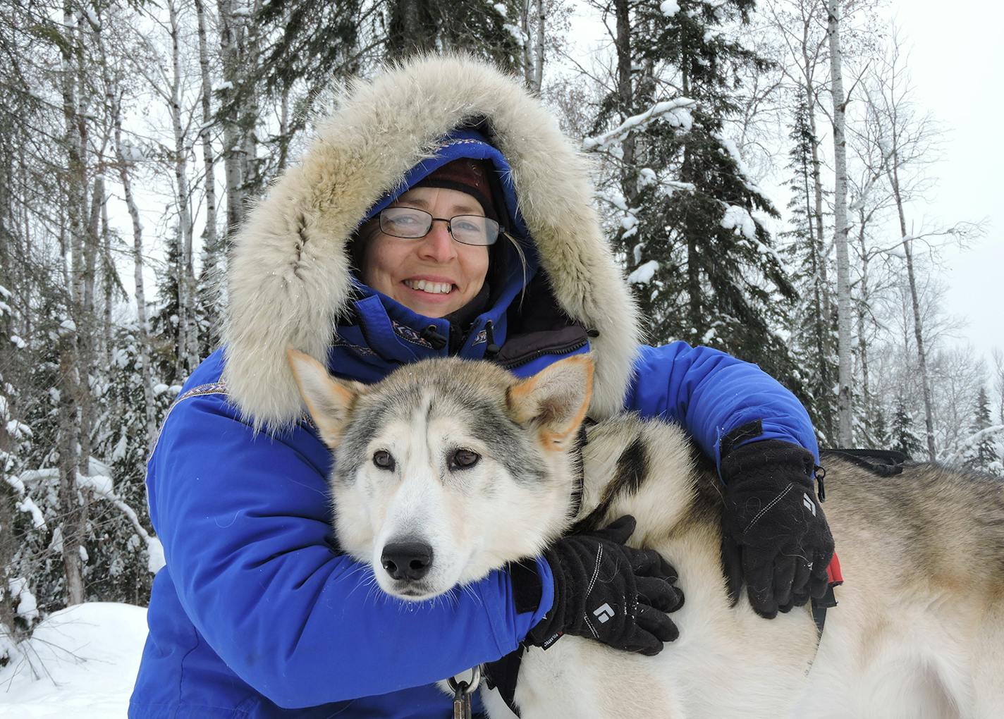 Points Unknown owner Linda Newman with one of her huskies.