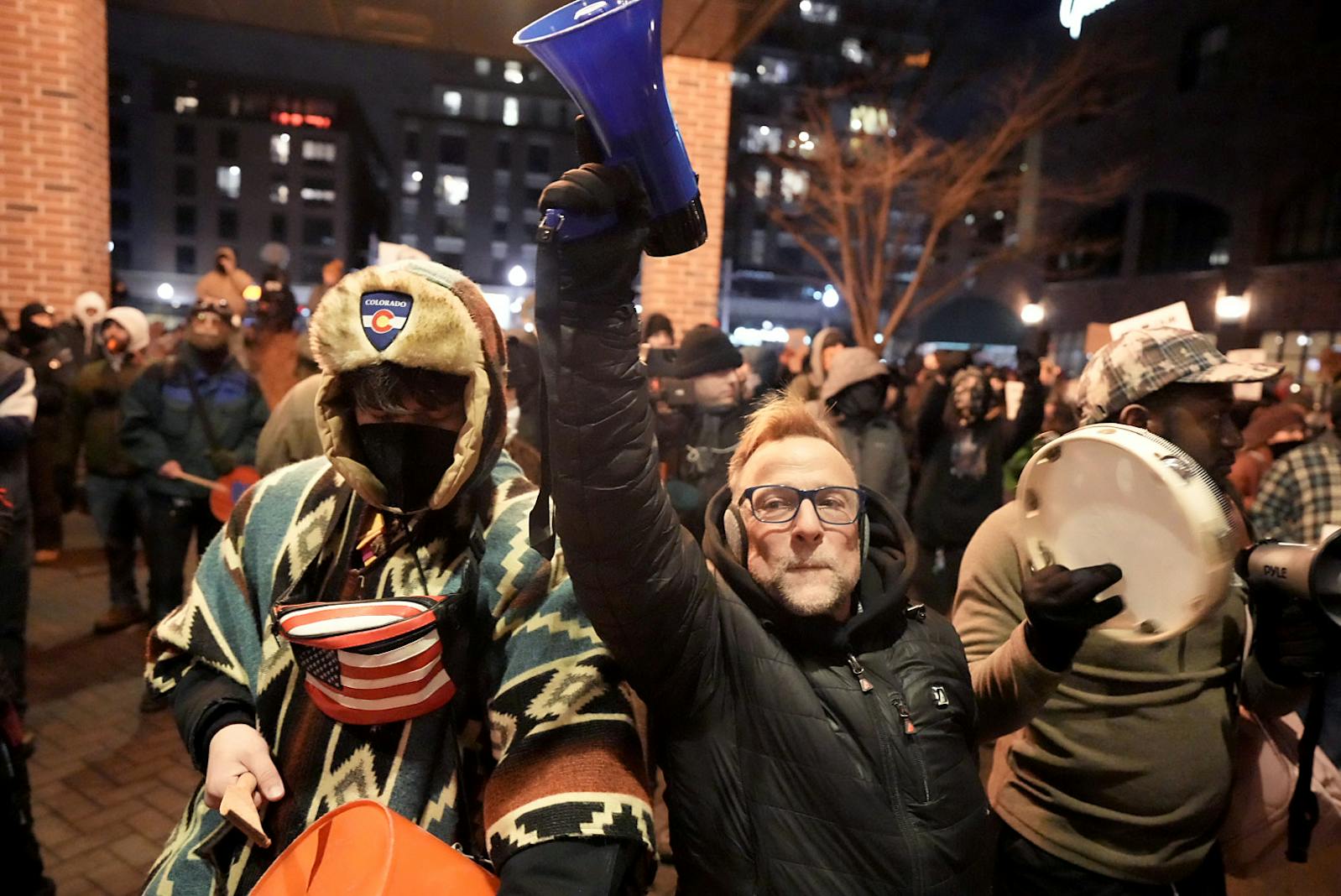 Demonstrators protest on Tuesday, Jan. 13, outside the Graduate by Hilton Minneapolis hotel, where ICE agents are believed to be staying.